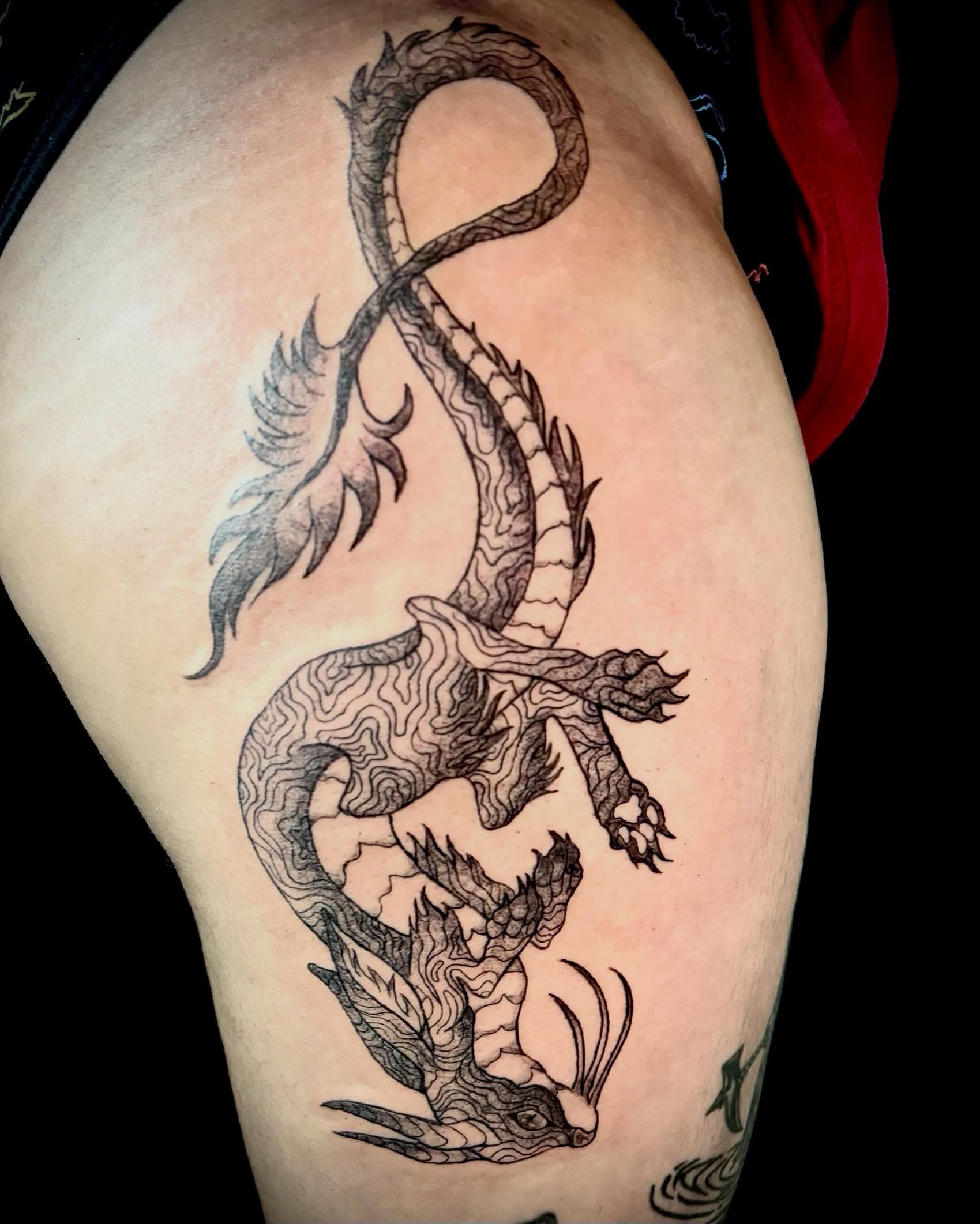 Dragon black and grey tattoo on the thigh by Abby Ruok, Midvale, Utah