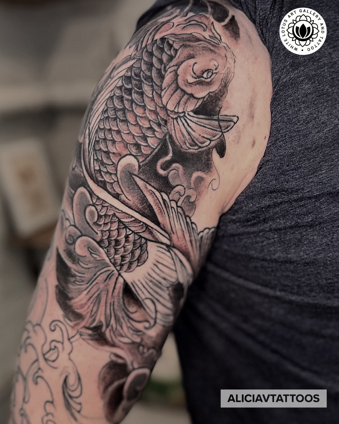 Koi fish japanese irezumi tattoo on the upper arm by Alicia Vasquez