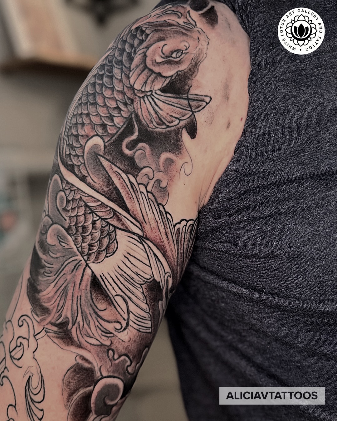 Koi fish japanese irezumi tattoo on the upper arm by Alicia Vasquez
