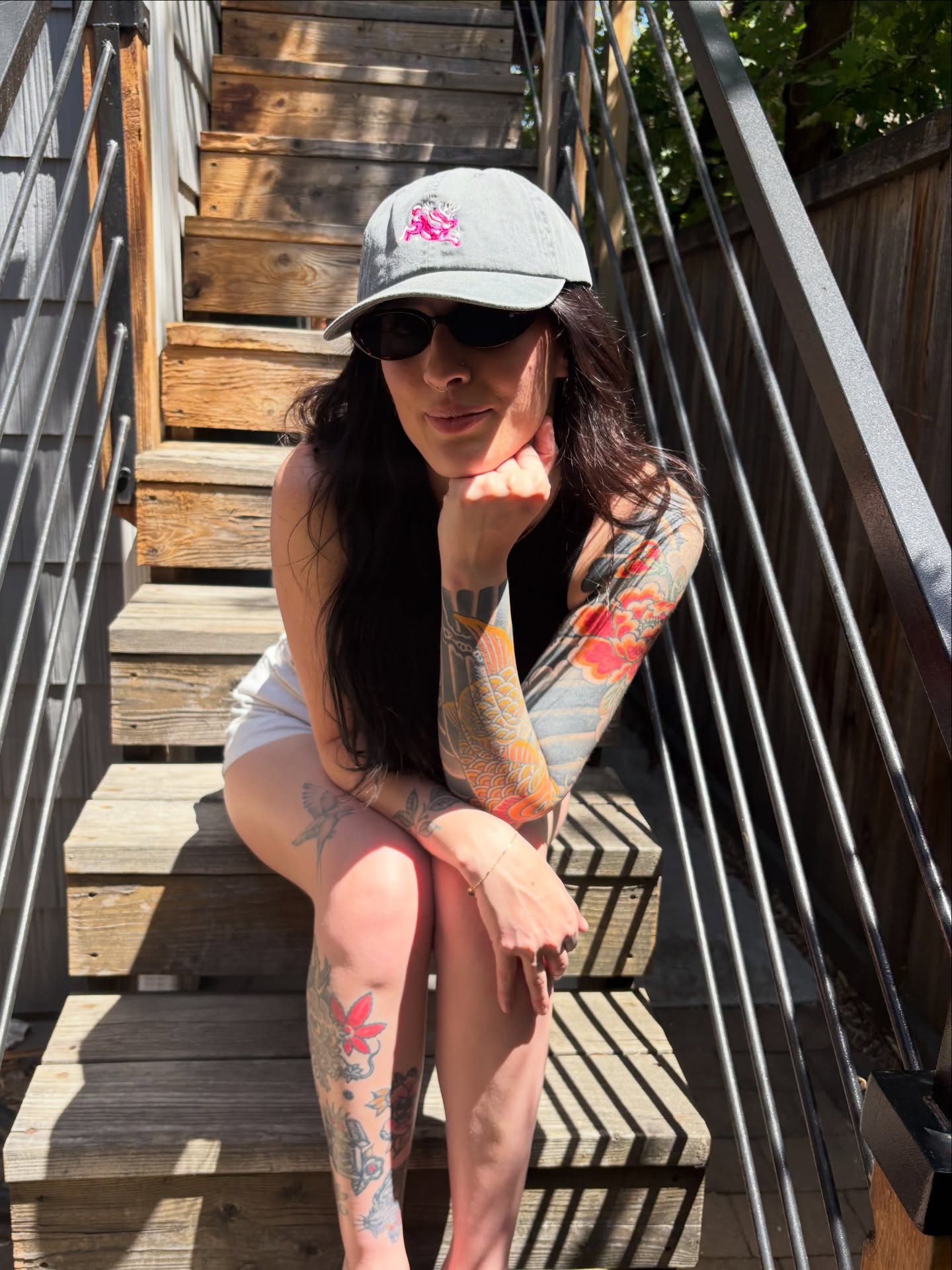 Floral patterns American traditional tattoo on the upper arm by Chloe Marie