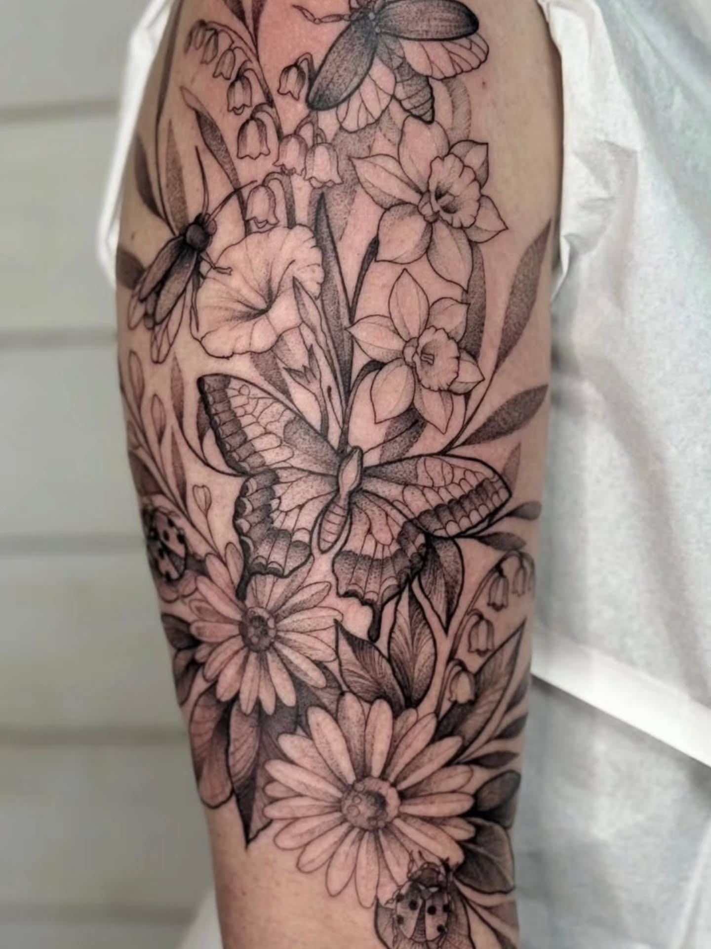 Floral bouquet dotwork tattoo on the forearm by Diana Muresan