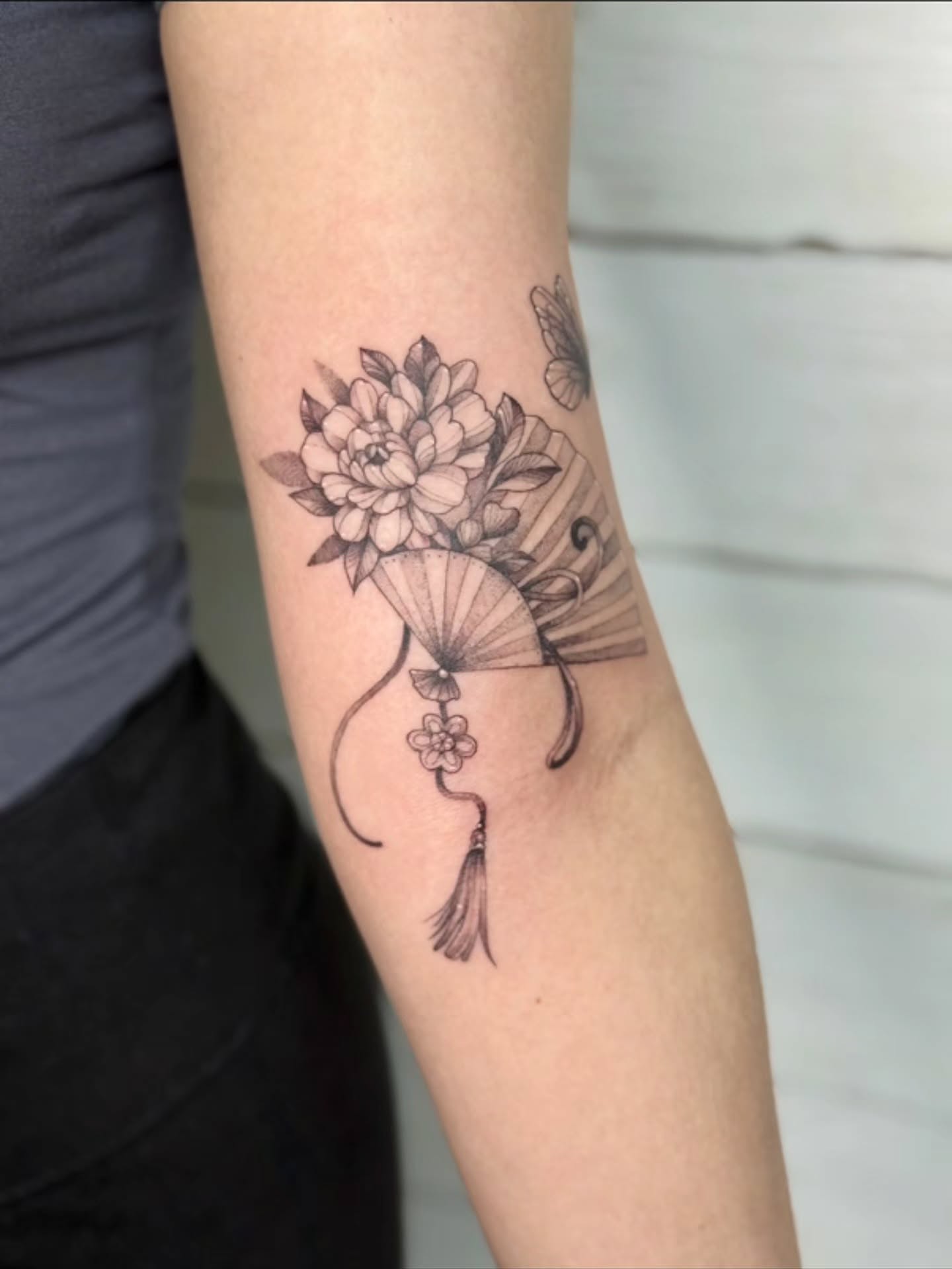Flower bouquet black and grey tattoo on the forearm by Diana Muresan