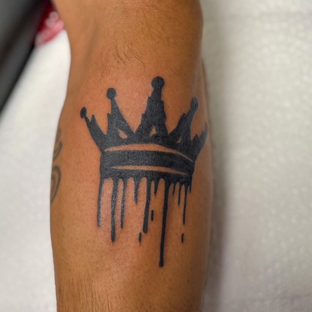 Crown black and grey tattoo on the forearm by Zac Tattooer