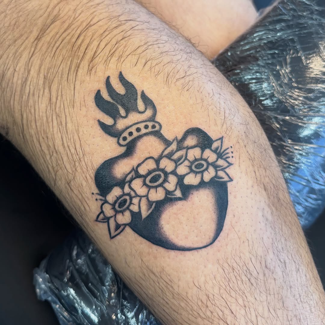 Flaming heart with flowers American traditional tattoo on the forearm by Béle Benard