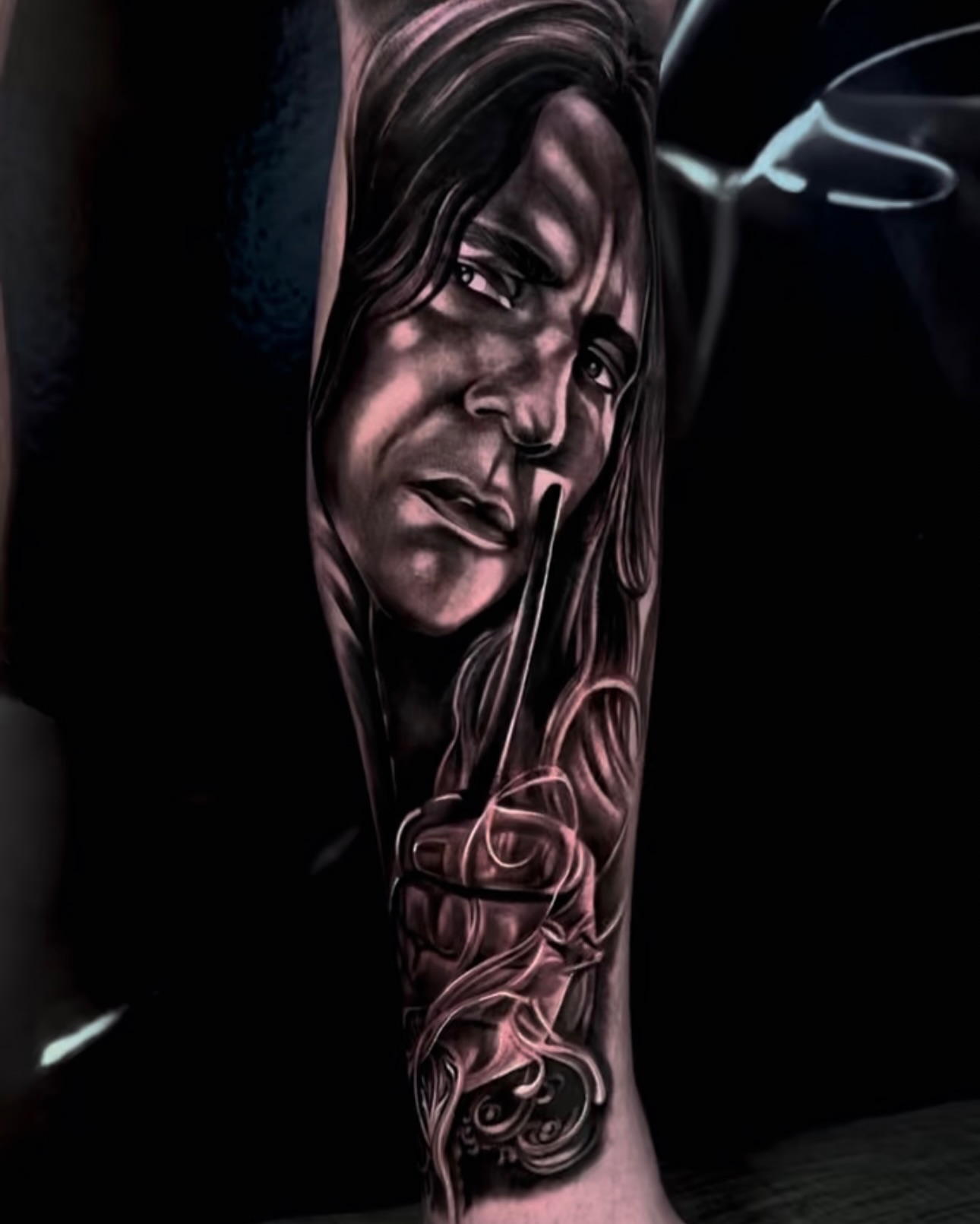Portrait realism tattoo on the forearm by Yudel