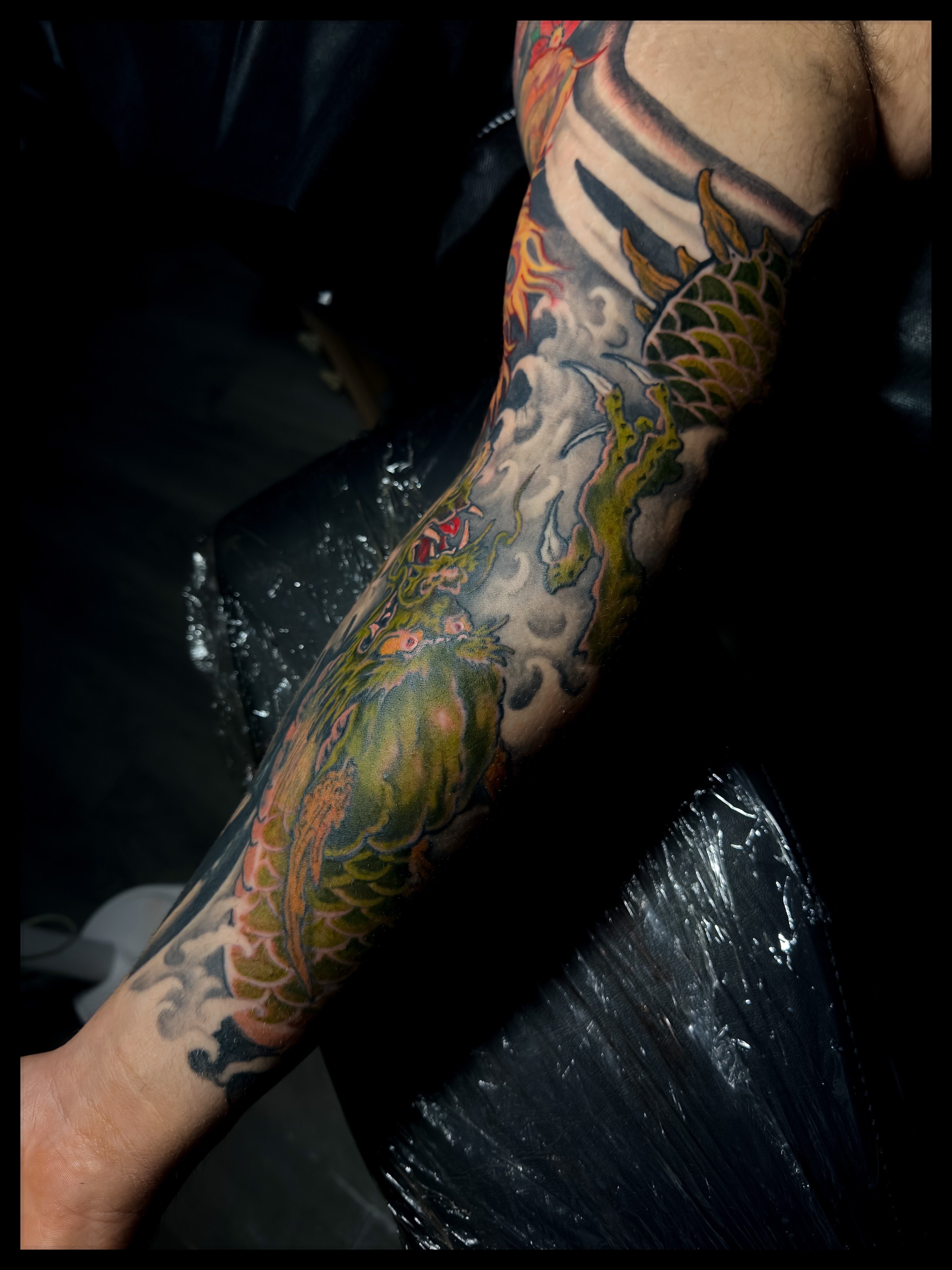 Dragon and clouds japanese irezumi tattoo on the forearm by Noah Morris
