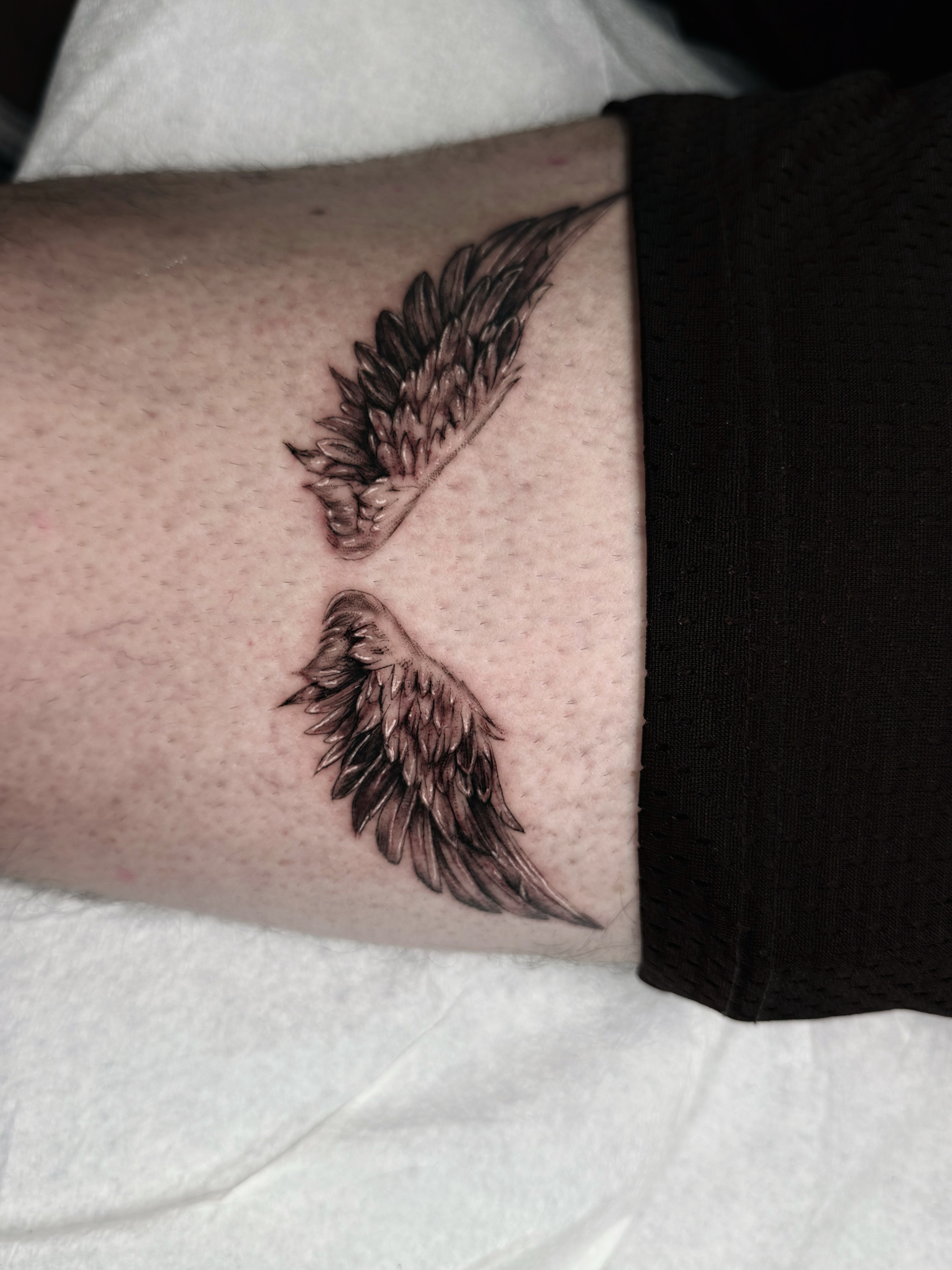 Wings black and grey tattoo on the forearm by viktoria raquel