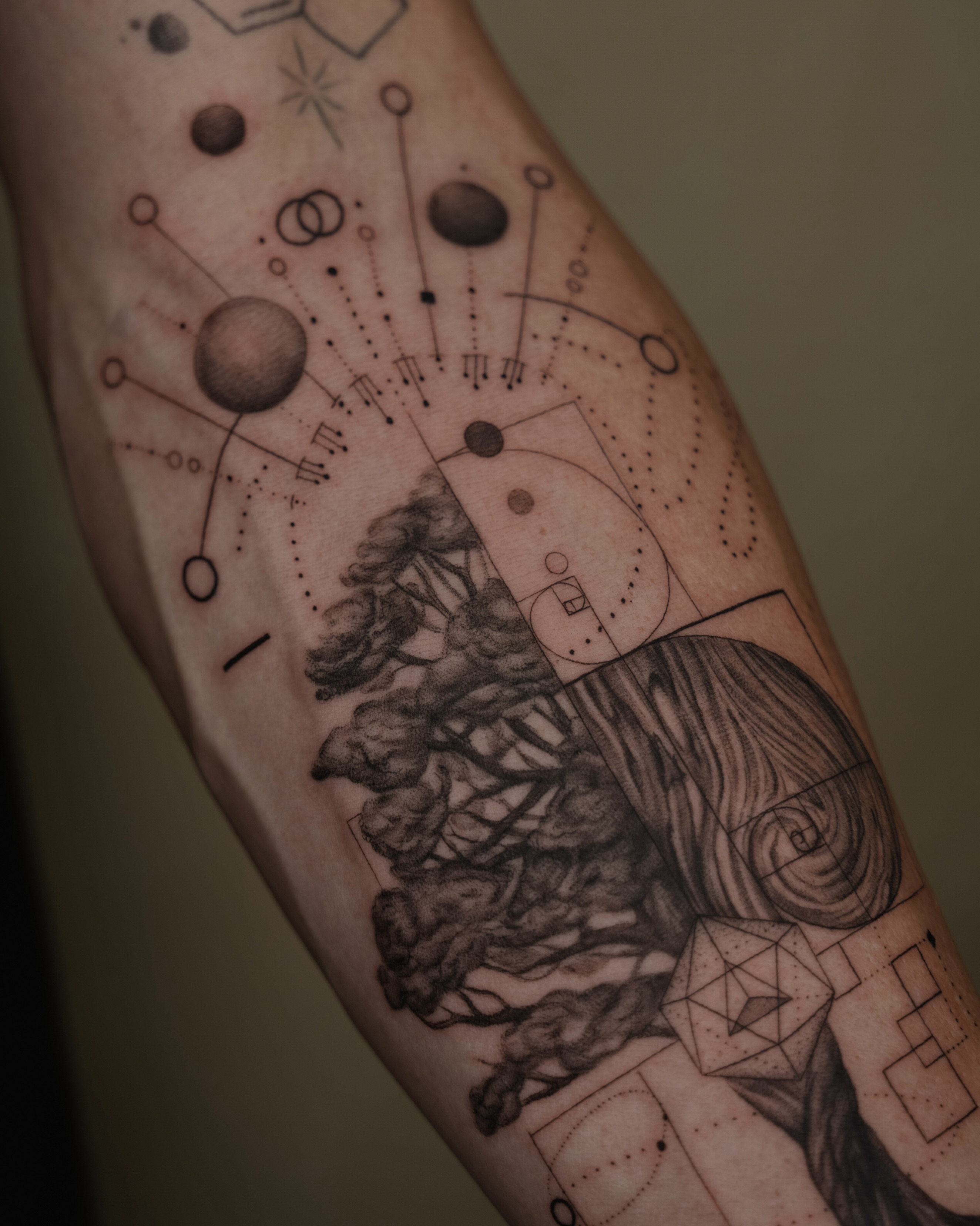 Abstract geometric design geometric tattoo on the forearm by Laura Gomez Tattoos