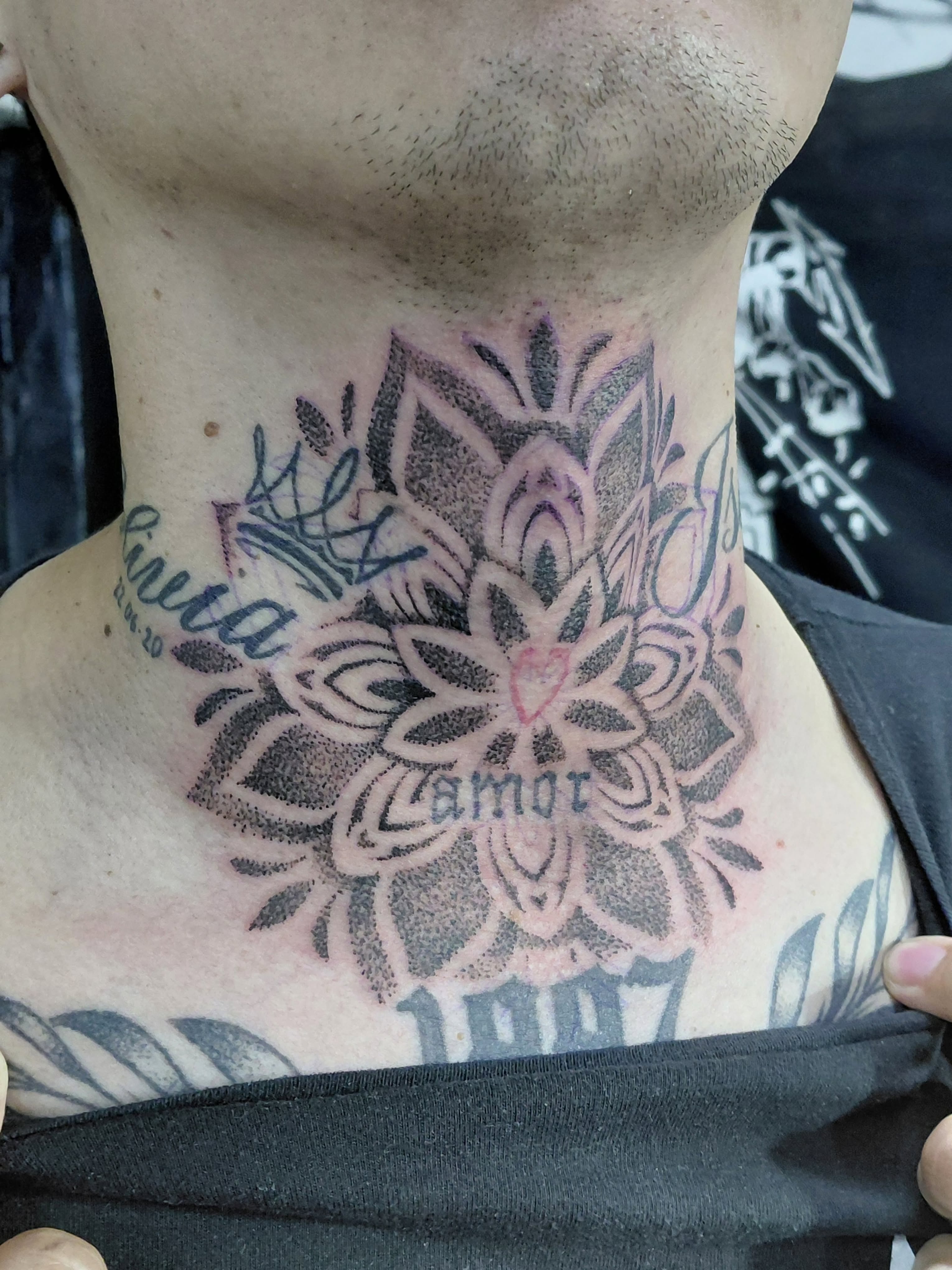 Flower dotwork tattoo on the neck by Jose Rodriguez