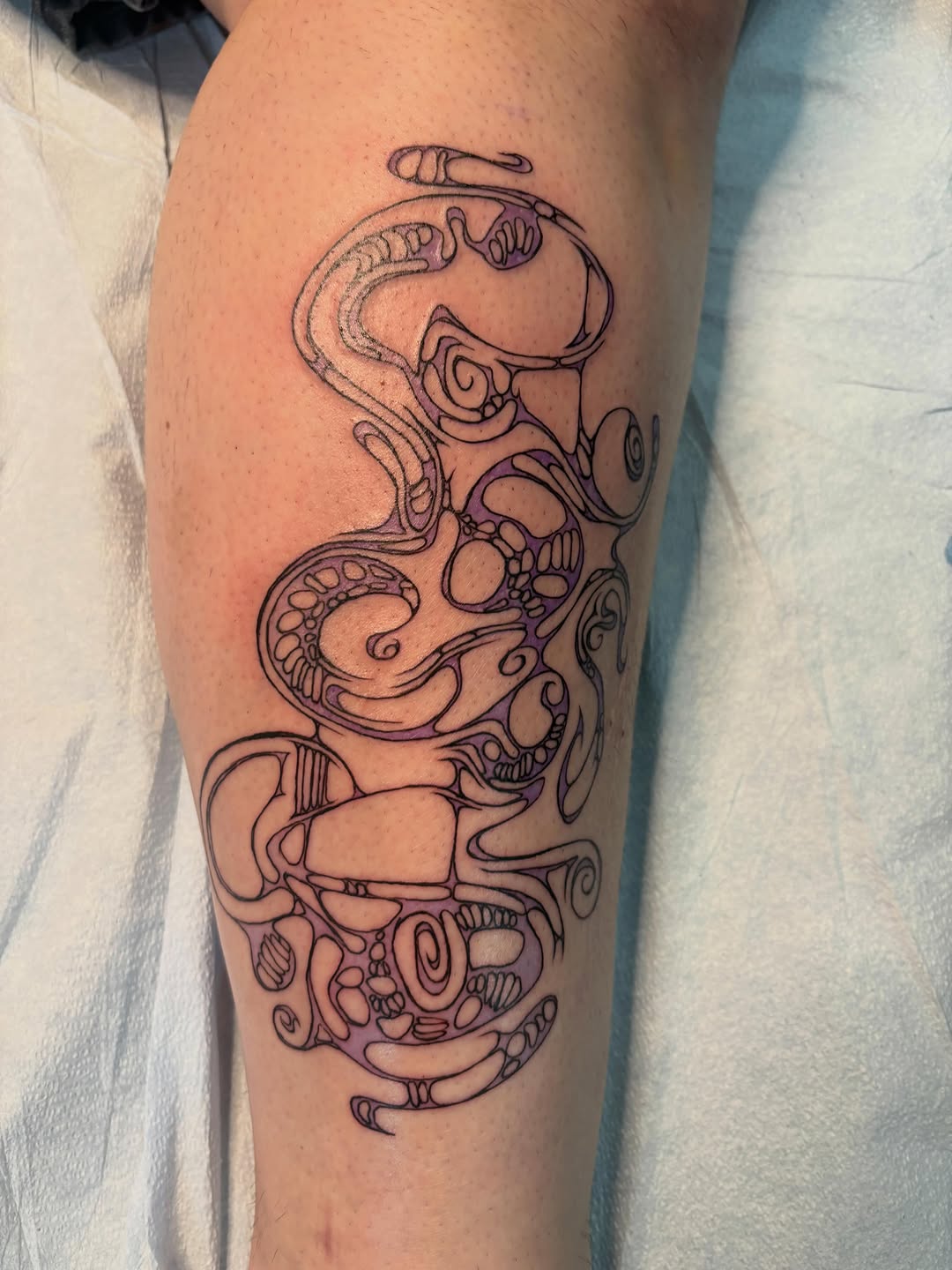 Abstract organic design sketch tattoo on the forearm by izzy solae