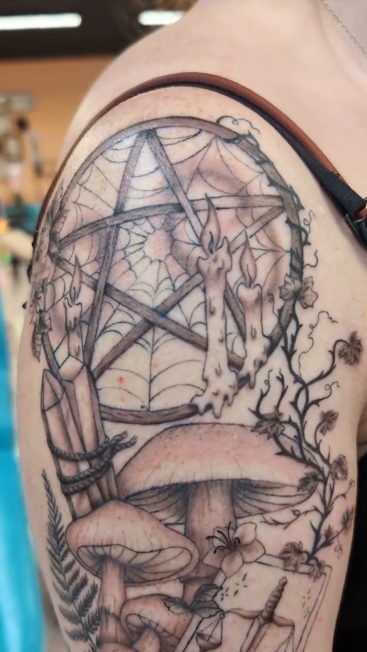 Mushrooms, tarot cards, and a pentagram sketch tattoo on the shoulder by Rhiannon
