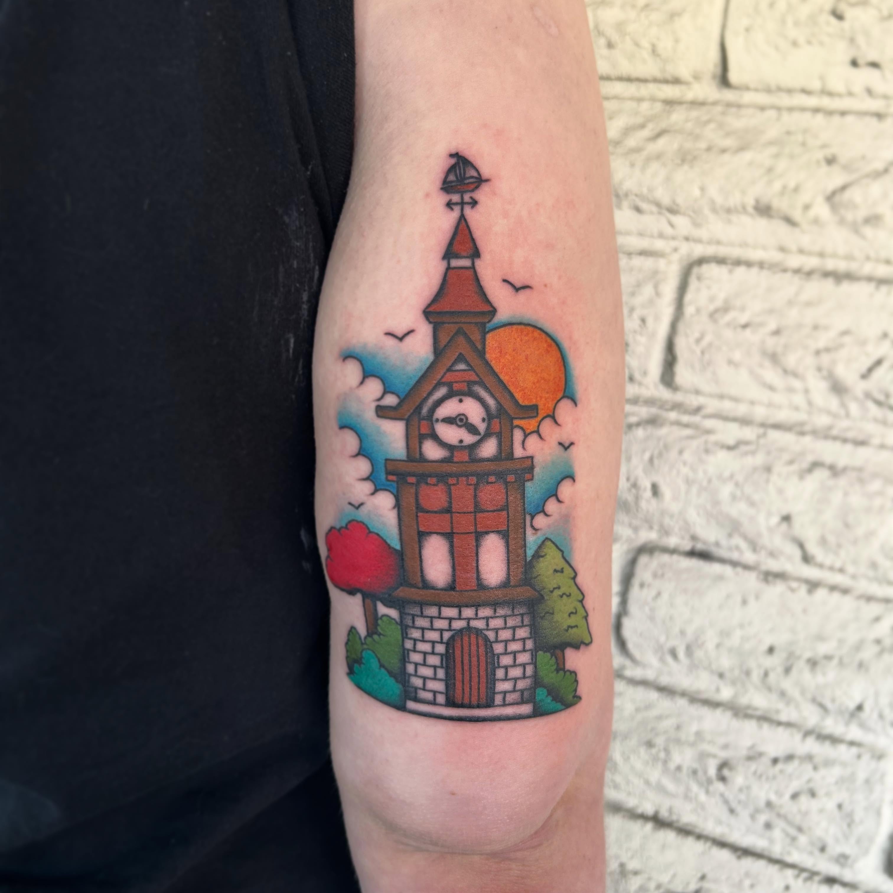 Clock tower American traditional tattoo on the forearm by Stephen Sanchez