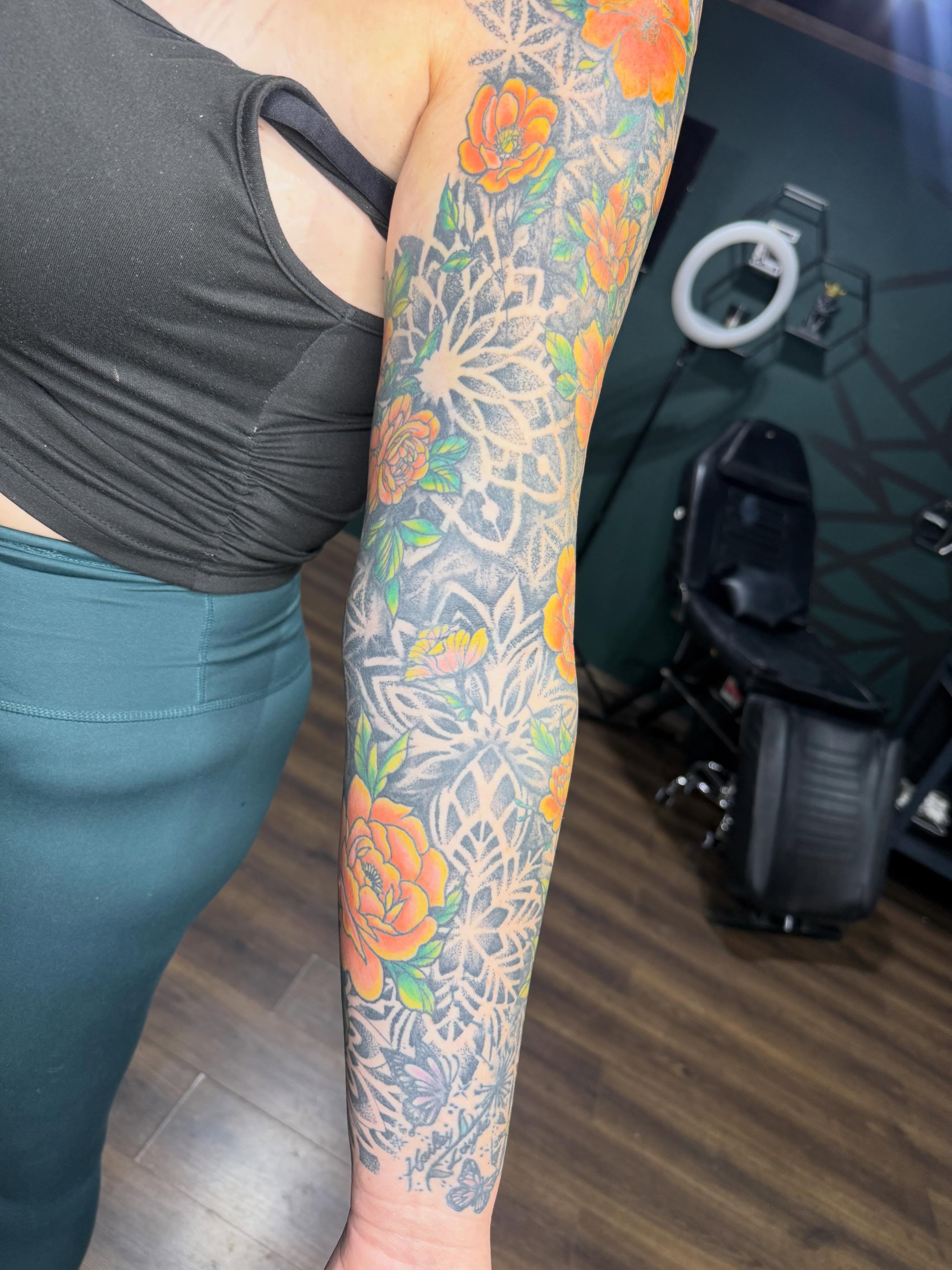Floral mandala American traditional tattoo on the forearm by Teara faith krigbaum
