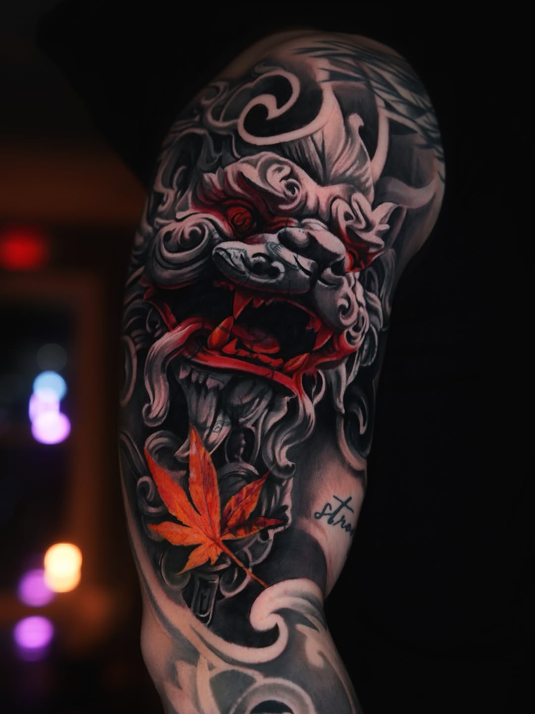 Foo dog with maple leaf Japanese tattoo on the forearm by Andres García Baeza