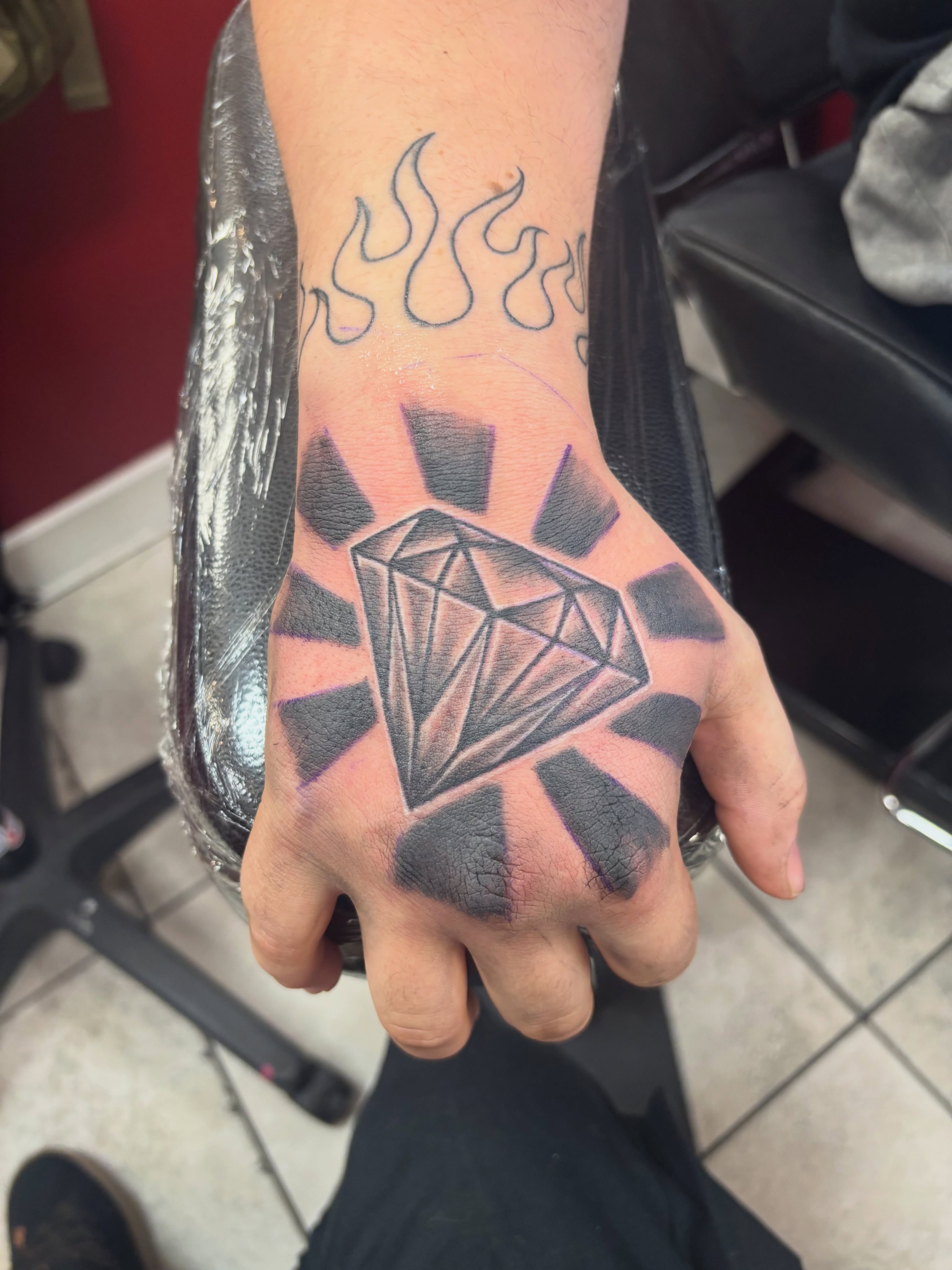 Diamond geometric tattoo on the hand by Thom Johns-Green