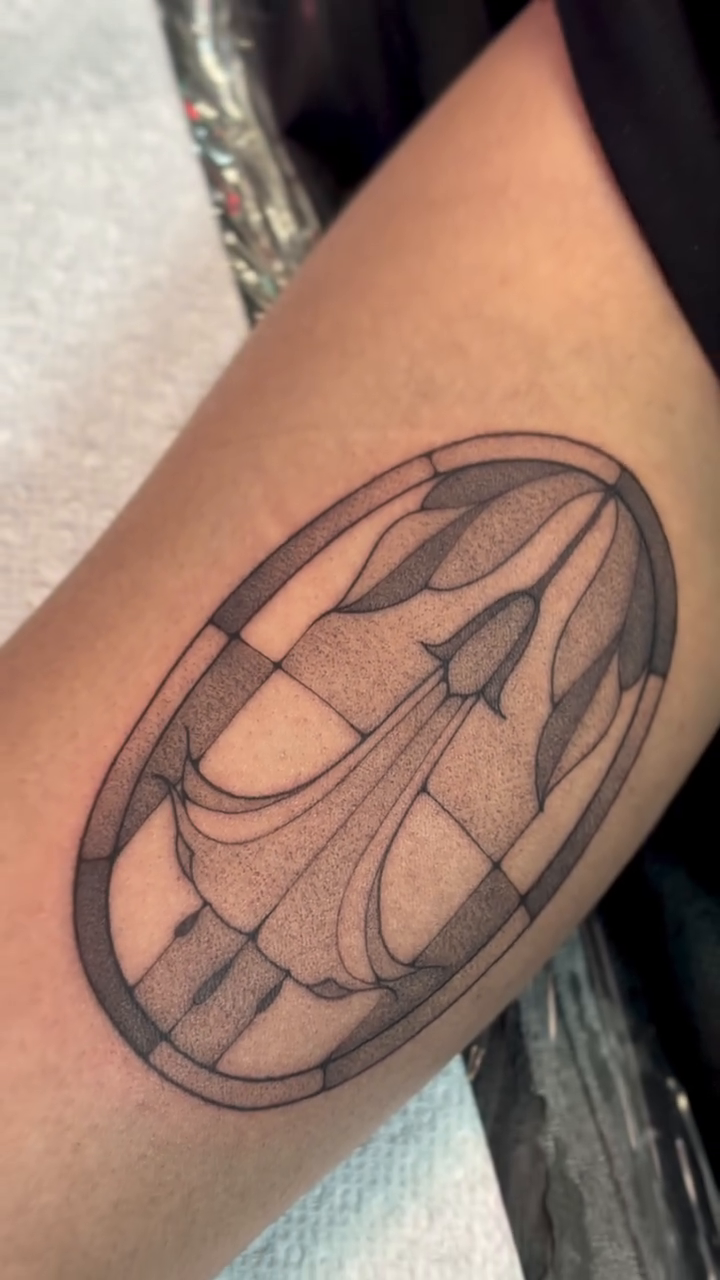 Stained glass window design sketch tattoo on the forearm by Victoria Lamorte