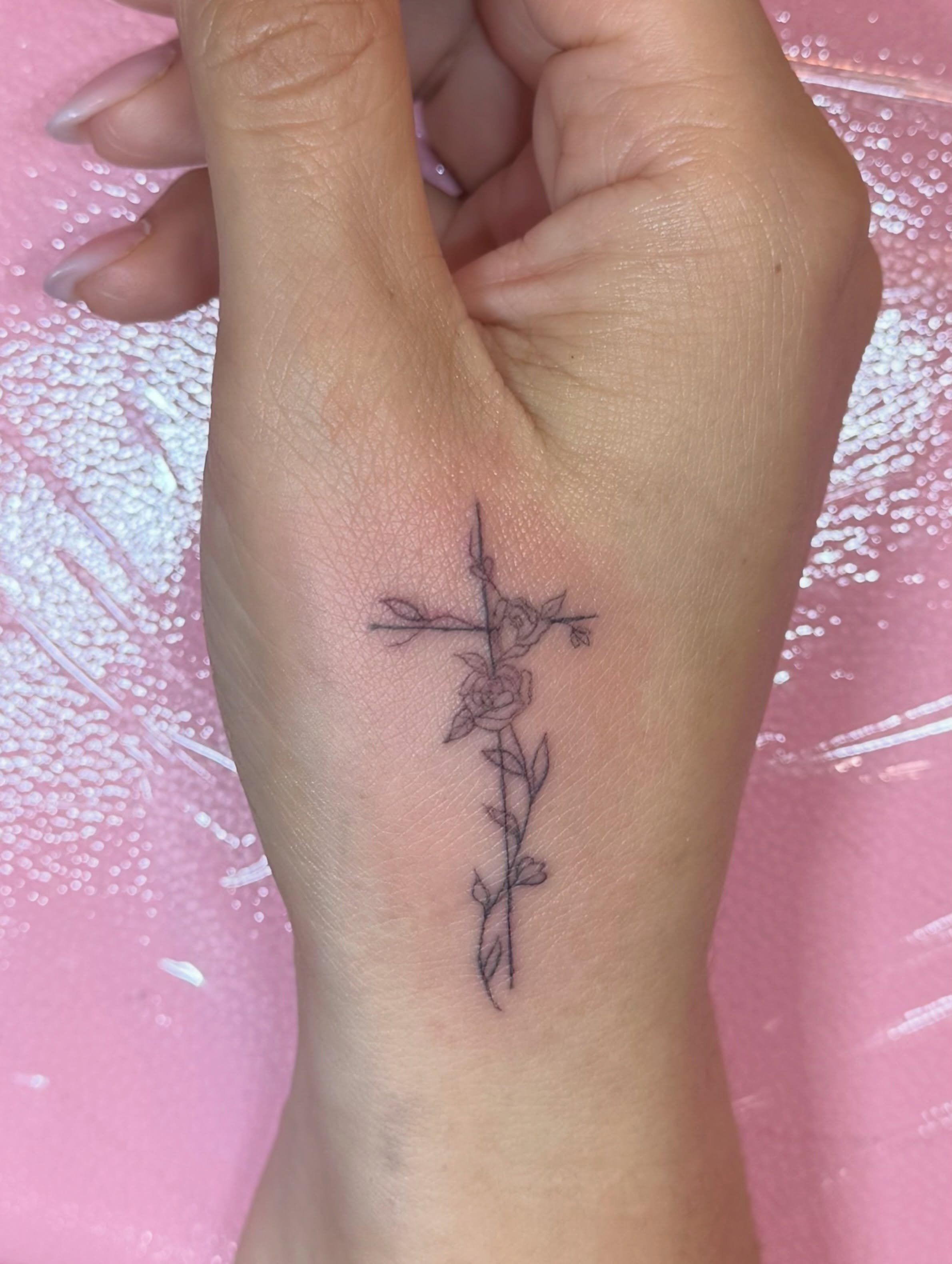 Cross with roses black and grey tattoo on the hand by fine line tattoo artist▪️Austin TX