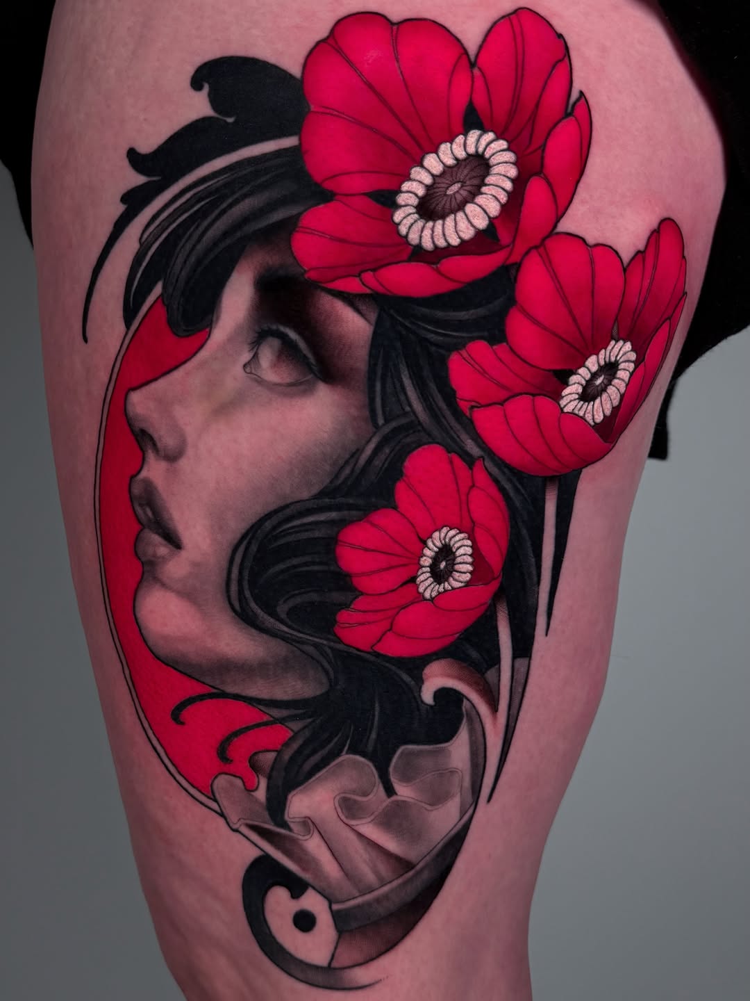 Woman's portrait with poppies neo-traditional tattoo on the thigh by Carlos Valdes ✨ Tattoo Artist in Tampa FL