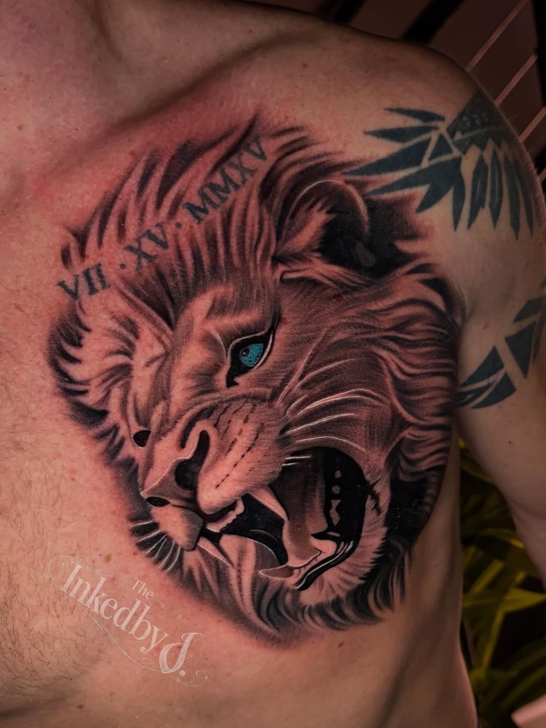 Lion head with roman numerals realism tattoo on the chest by Jaylen - Atlanta Tattoo Artist
