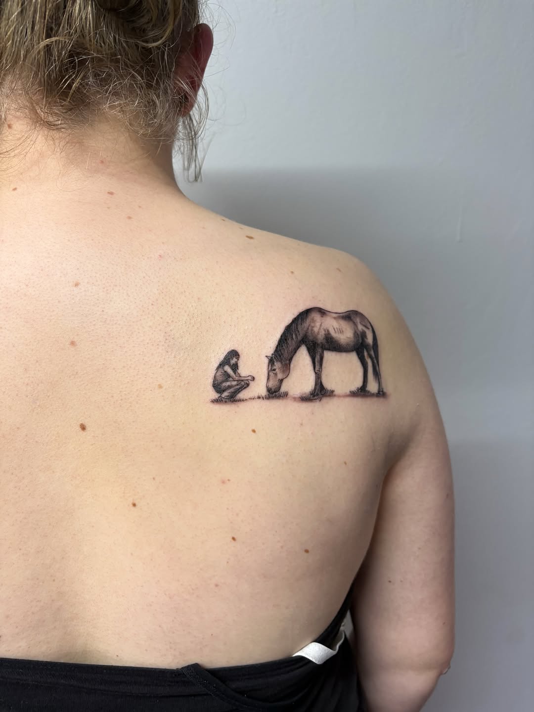 Person and horse fine line tattoo on the shoulder by Art by Aimee