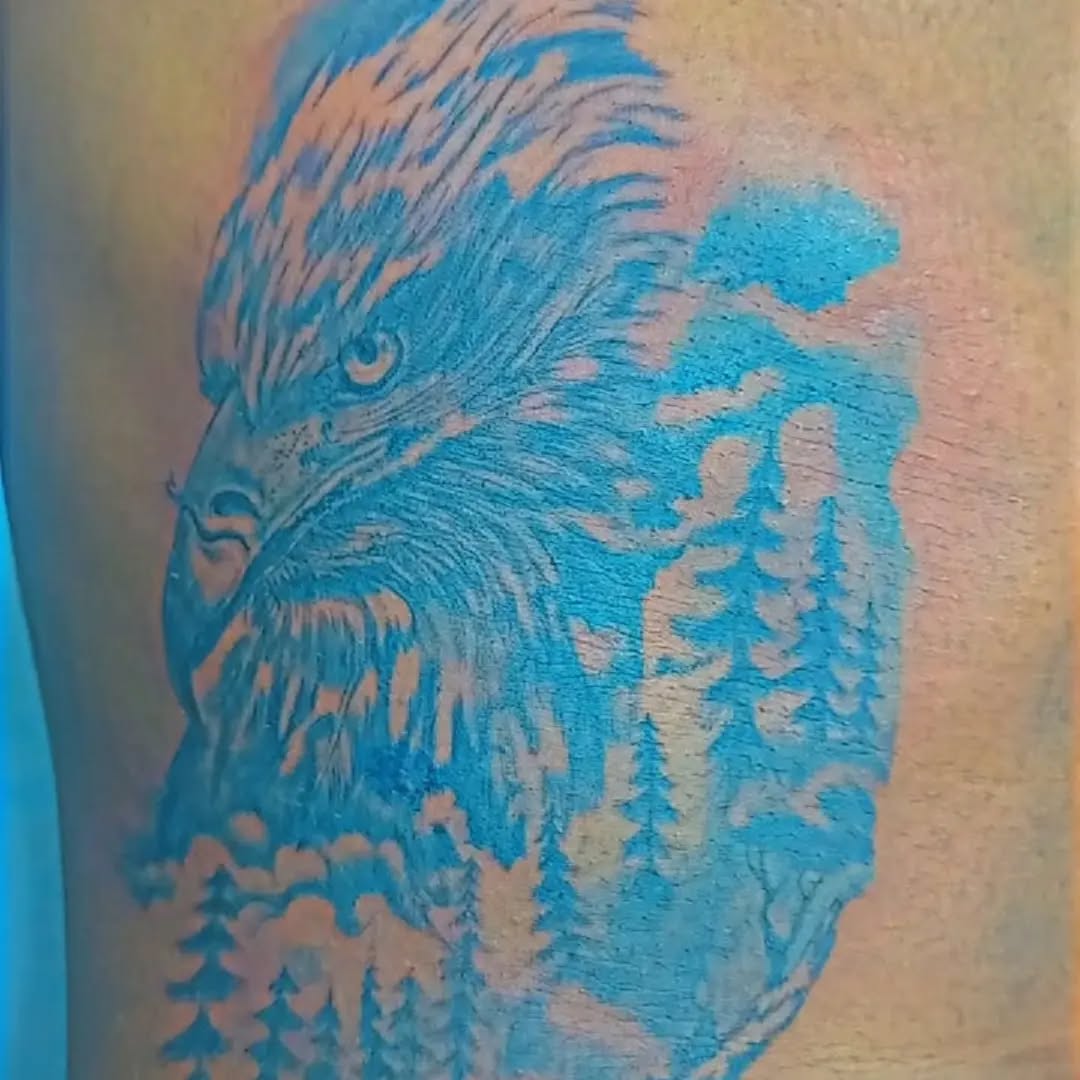 Eagle and forest realism tattoo on the forearm by Mwangaza Bodyworks, Uthiru, Nairobi Area, Kenya