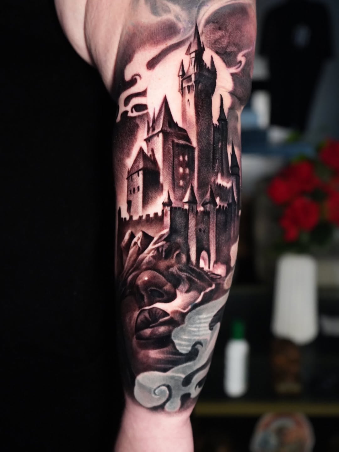 Castle and face dark art tattoo on the forearm by Robert Morton, Cleveland, Ohio