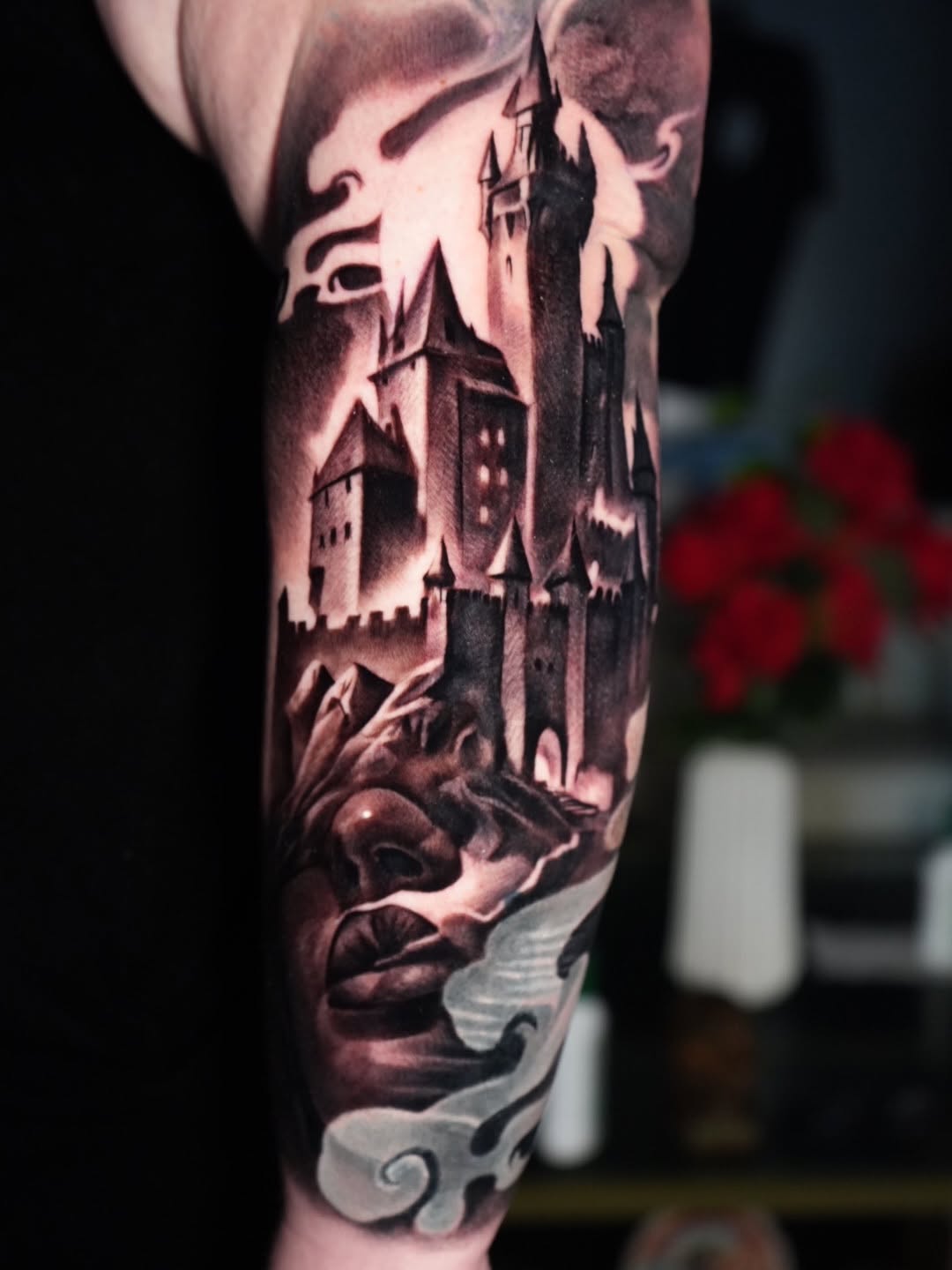 Castle and face dark art tattoo on the forearm by Robert Morton, Cleveland, Ohio