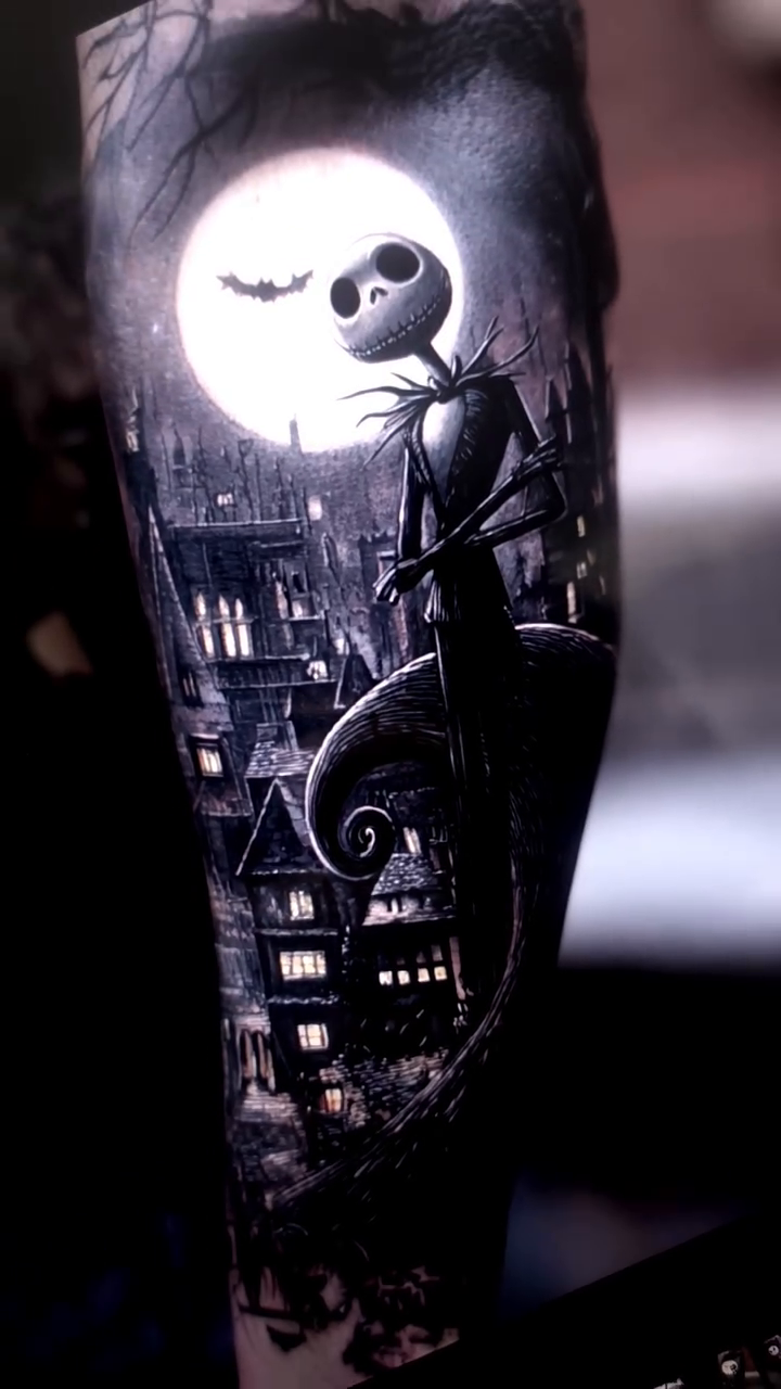 Jack Skellington and Halloween Town dark art tattoo on the forearm by Xavier NYC TATTOO ARTIST