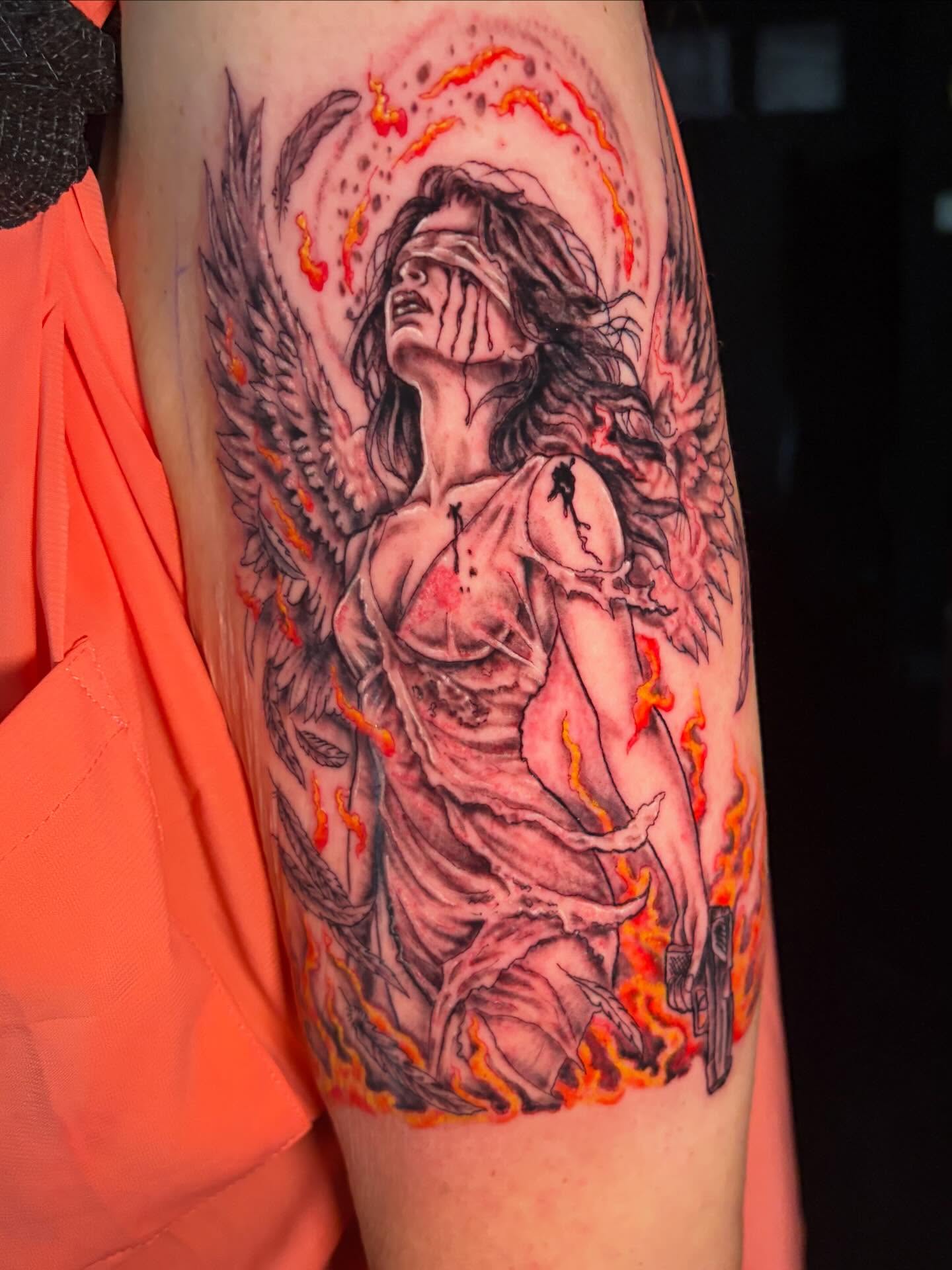 Angelic figure dark realism tattoo on the forearm by Fredrick Tigerman