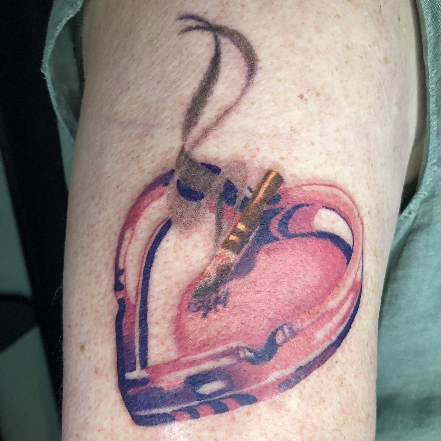 Heart with guitar American traditional tattoo on the forearm by Rowan Lee