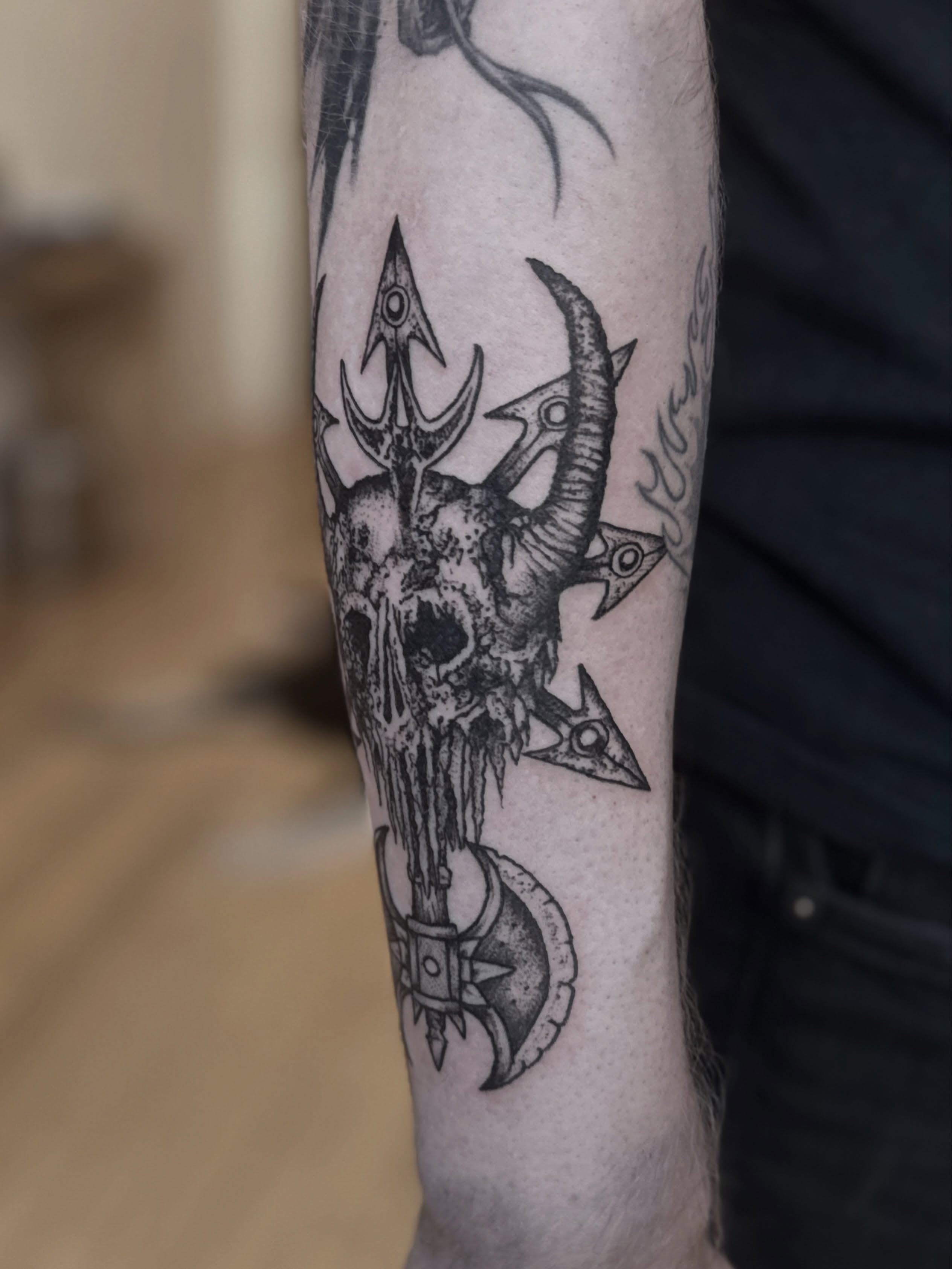 Skull with tridents dark realism tattoo on the forearm by Tattoo Artist, Philadelphia, Pennsylvania
