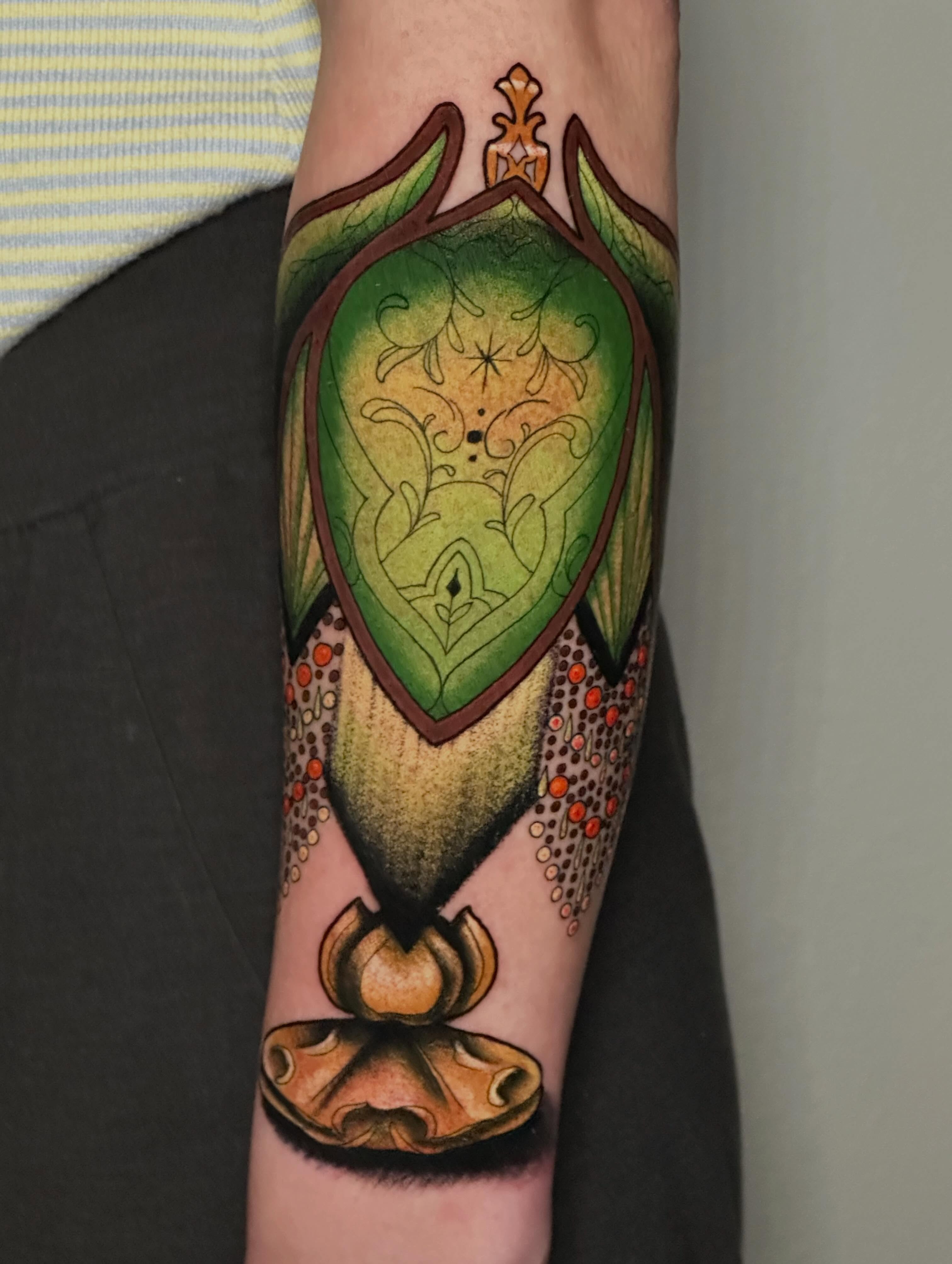 Shield dotwork tattoo on the forearm by Liz McDonald