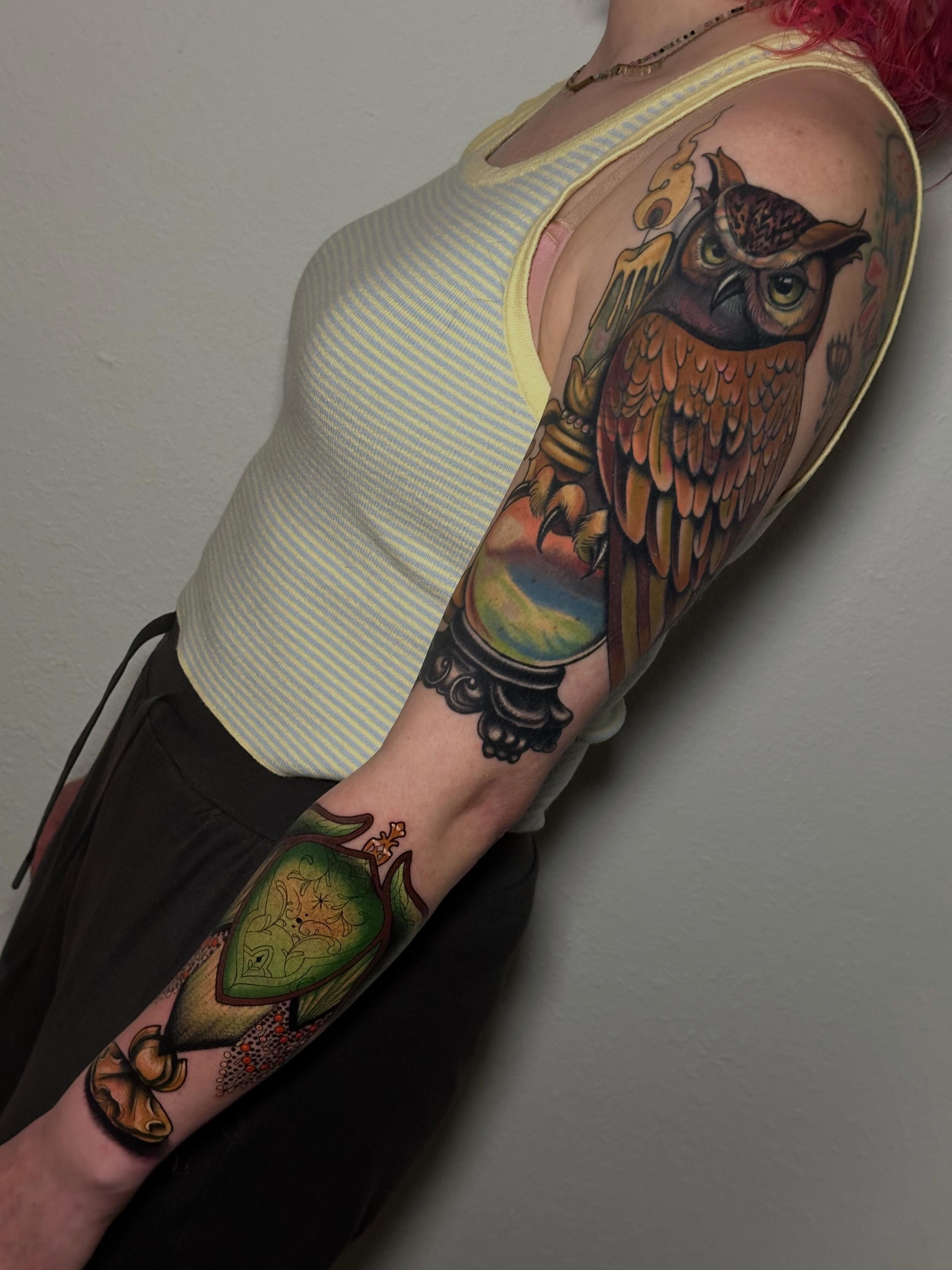 Owl American traditional tattoo on the upper arm by Liz McDonald