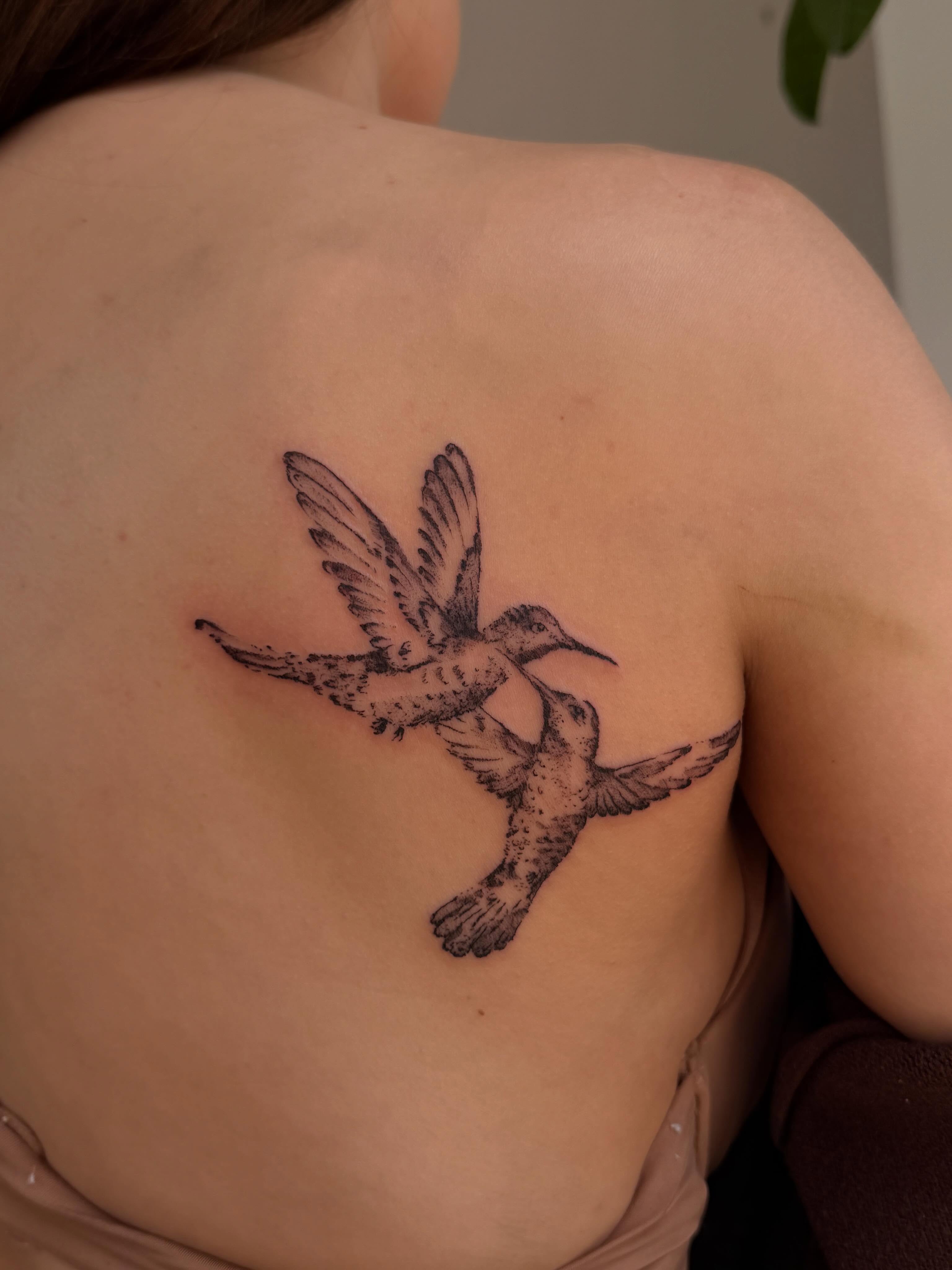 Hummingbirds black and grey tattoo on the back by Babymaxy Inks Llc
