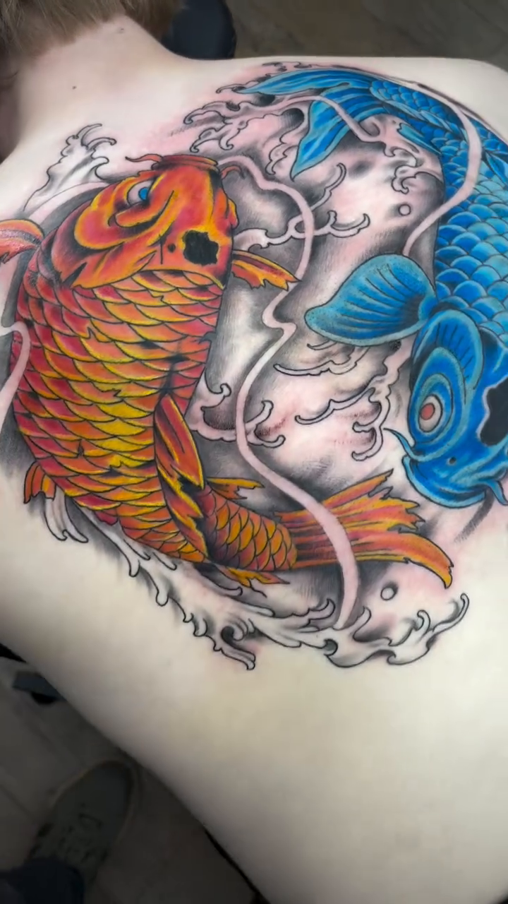 Yin Yang Koi fish tattoo Japanese tattoo on the back by Robbie Reel, Wichita, Kansas