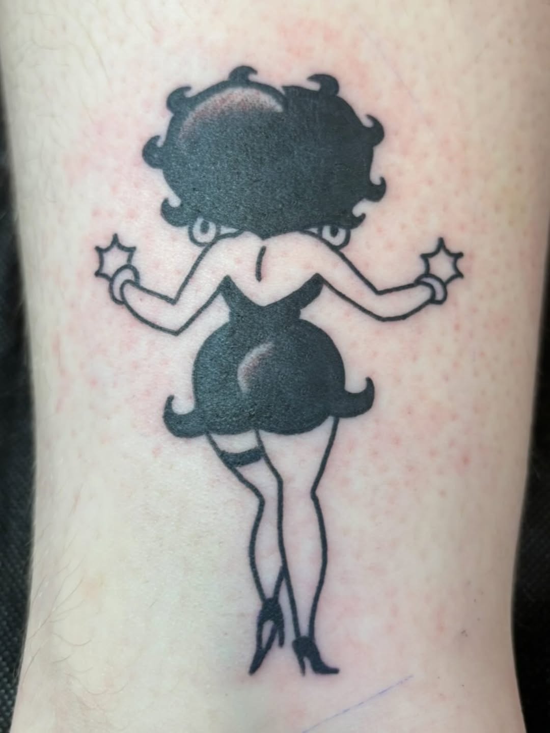 Betty Boop silhouette neo-traditional tattoo on the forearm by dayton skuse, Portland, Oregon