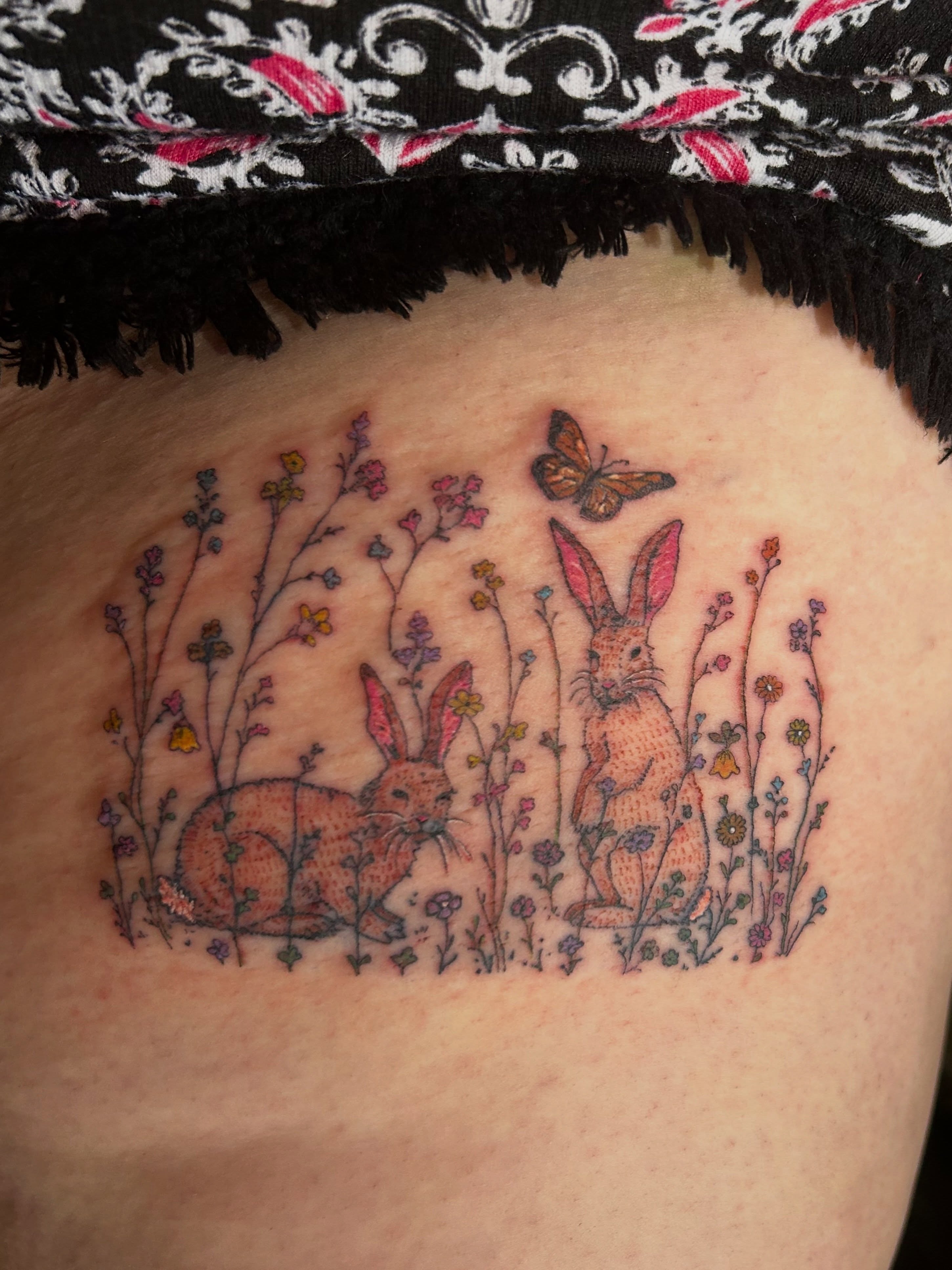 Rabbits and butterfly illustrative tattoo on the shoulder by Mattie Robinson