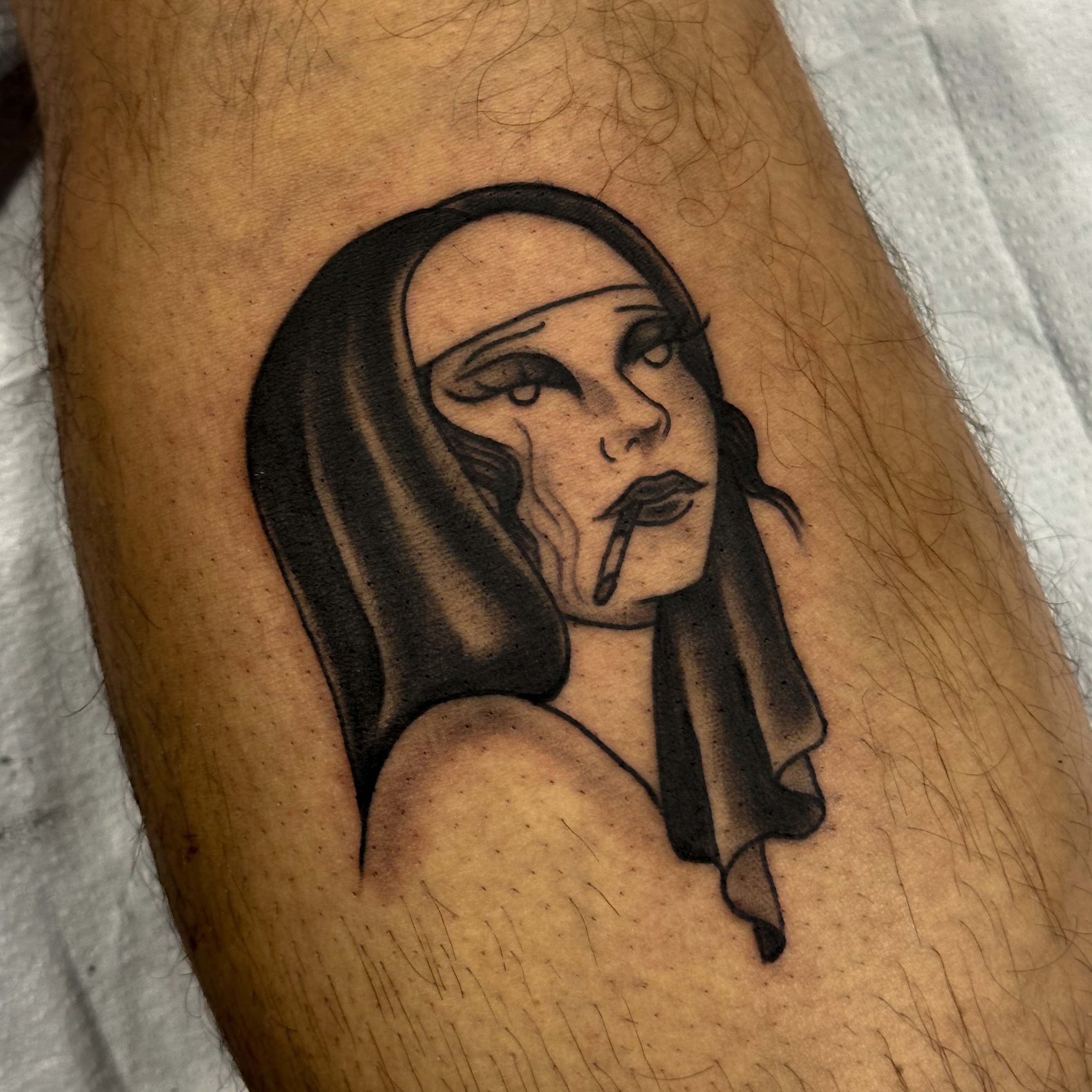Woman smoking black and grey tattoo on the forearm by Victoria