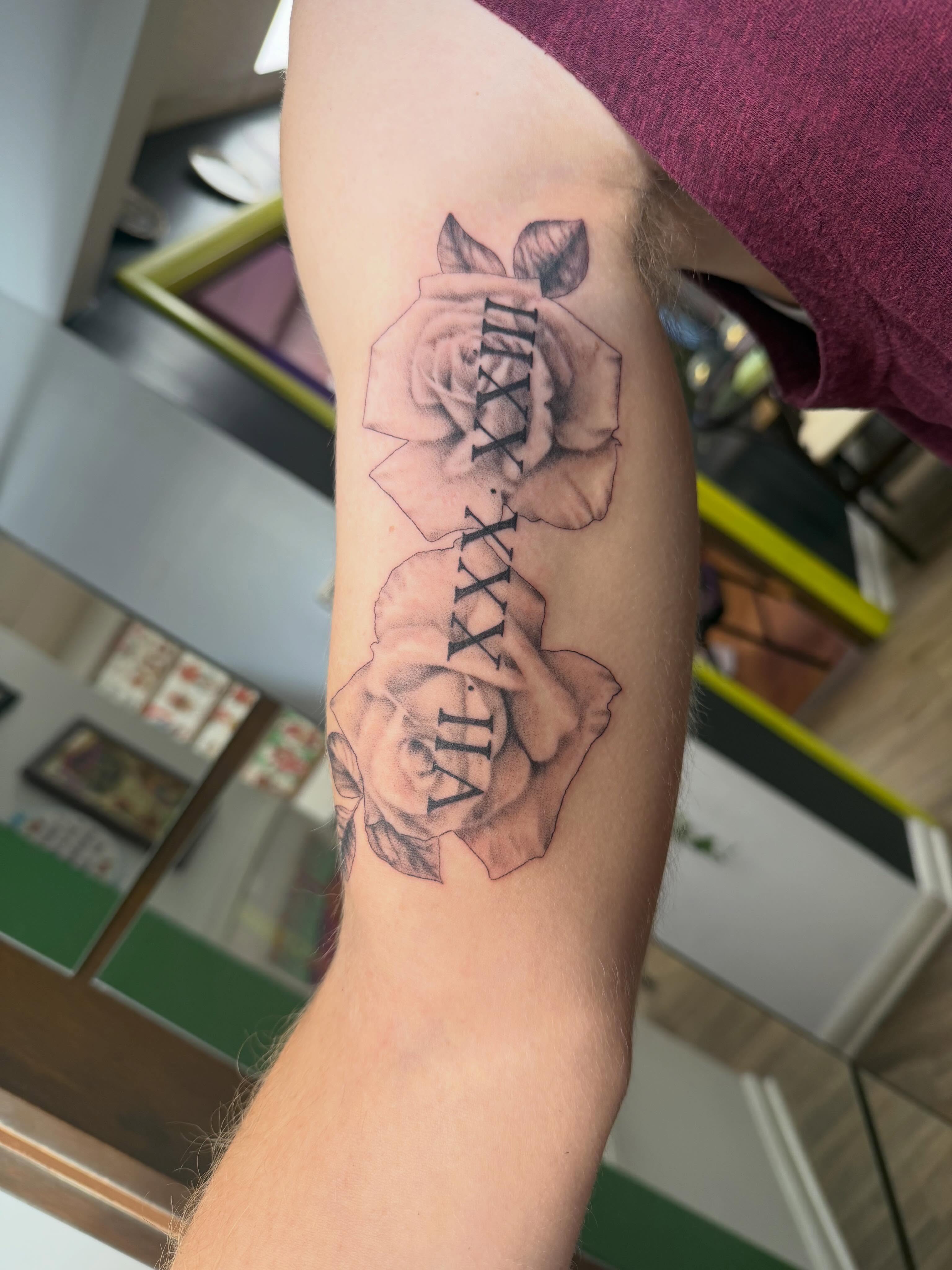 Roses and Roman numerals realism tattoo on the forearm by Rebecca (Becca) Ray