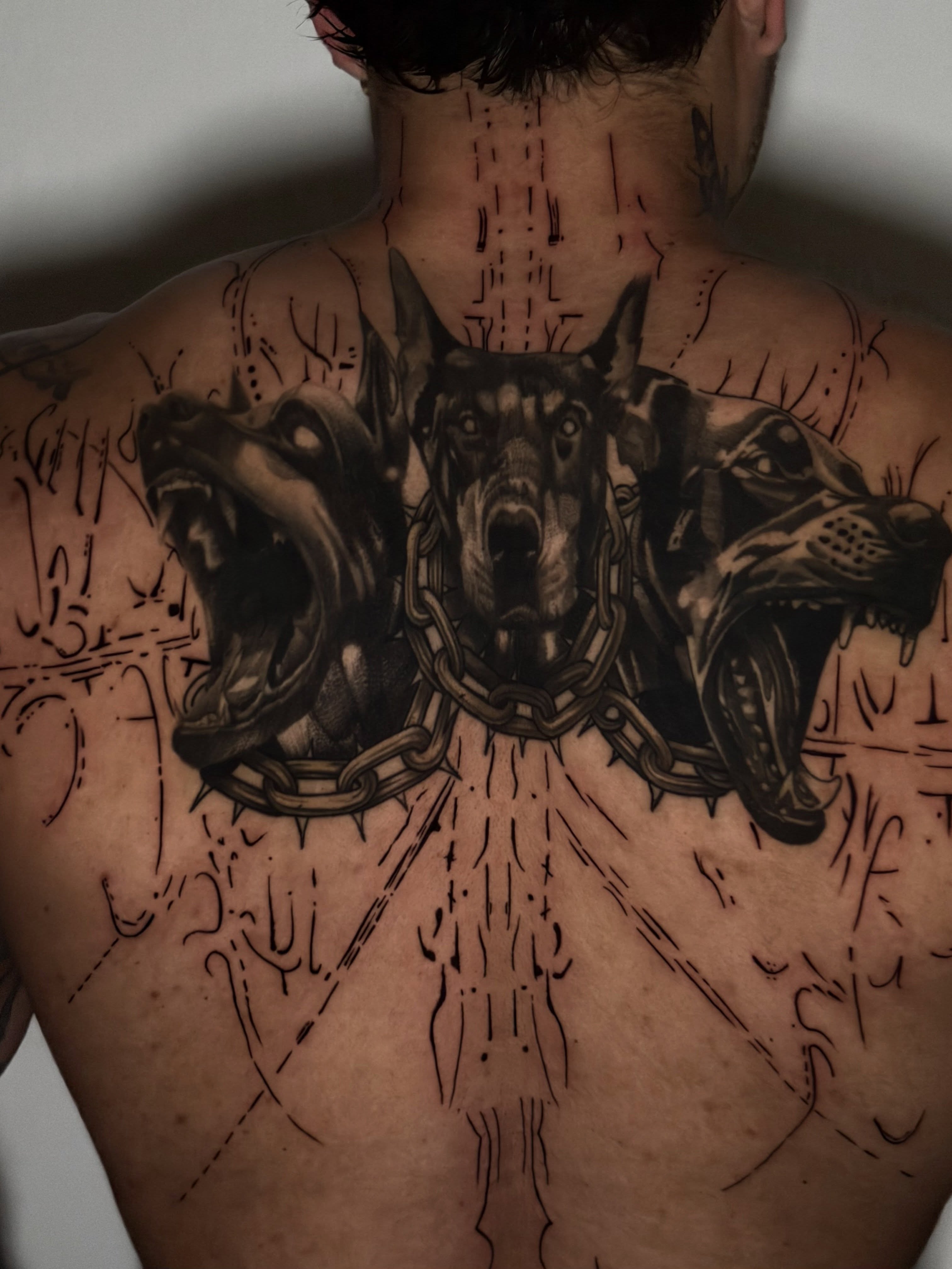 Three dogs realism tattoo on the back by Giovanni Rodriguez, Eastpointe, Michigan