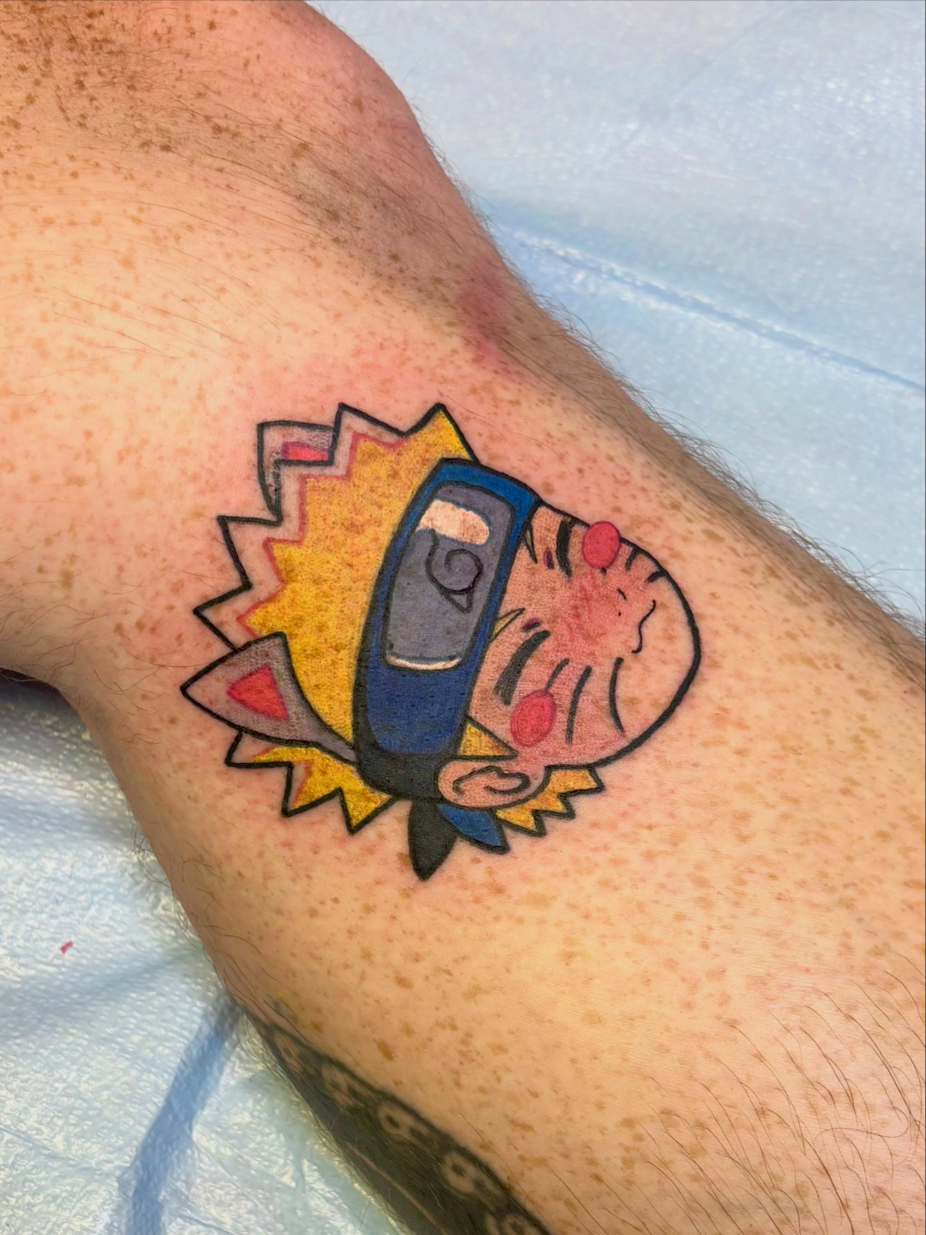 Phone and tiger new school tattoo on the forearm by Sarah Baldwin