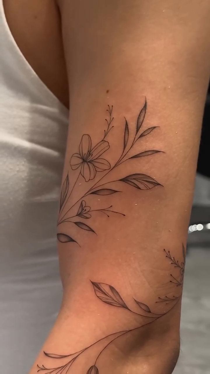 Floral vine tattoo on arm fine line tattoo on the forearm by Jennifer Garcia R - Vegas tattoo artist