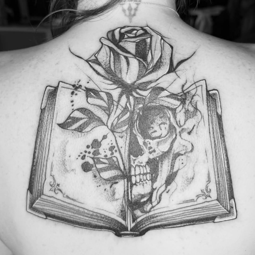Book with skull and rose dotwork tattoo on the back by Aiden Shaw