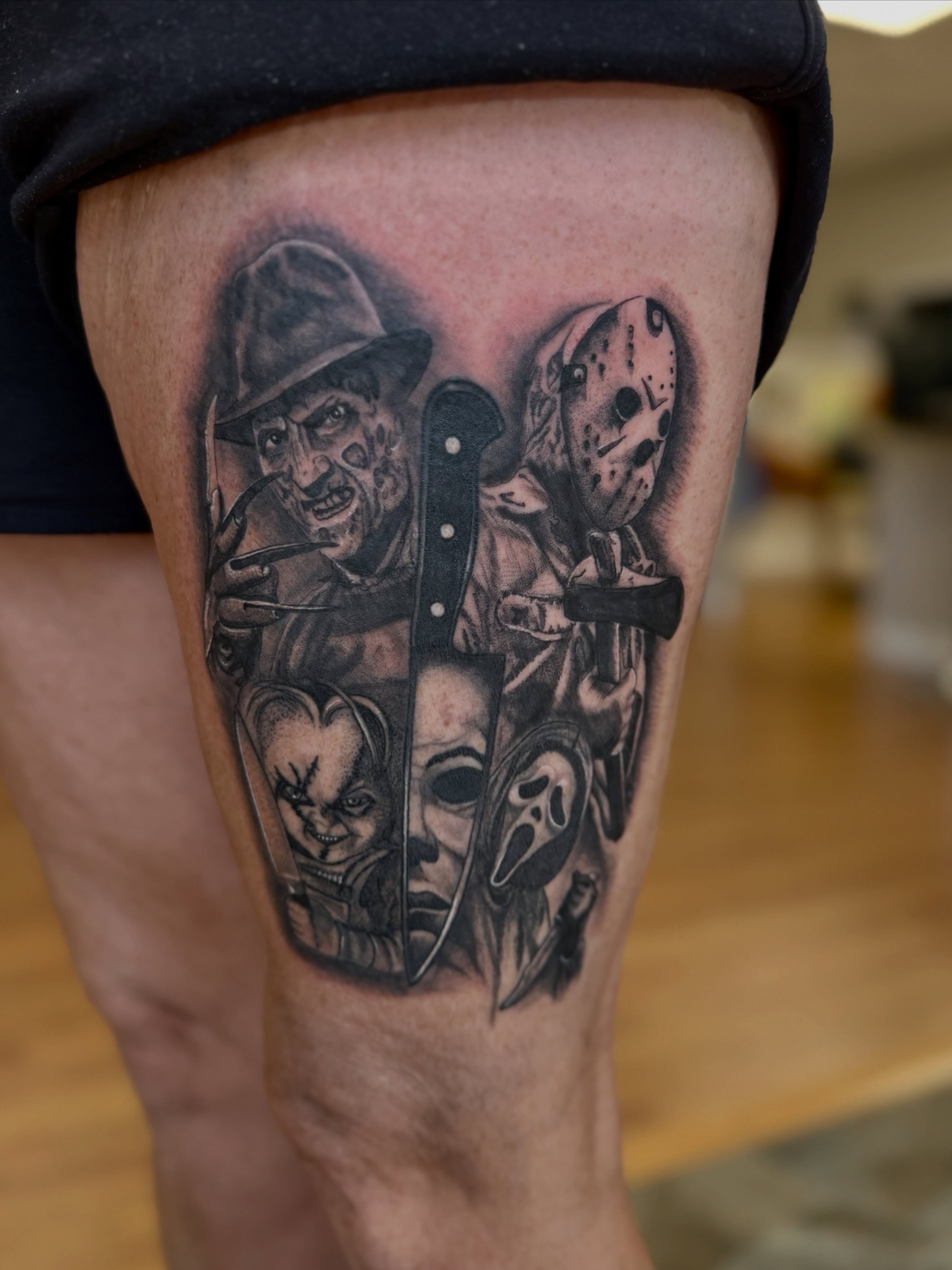 Horror movie characters realism tattoo on the thigh by Skylar Sheeley