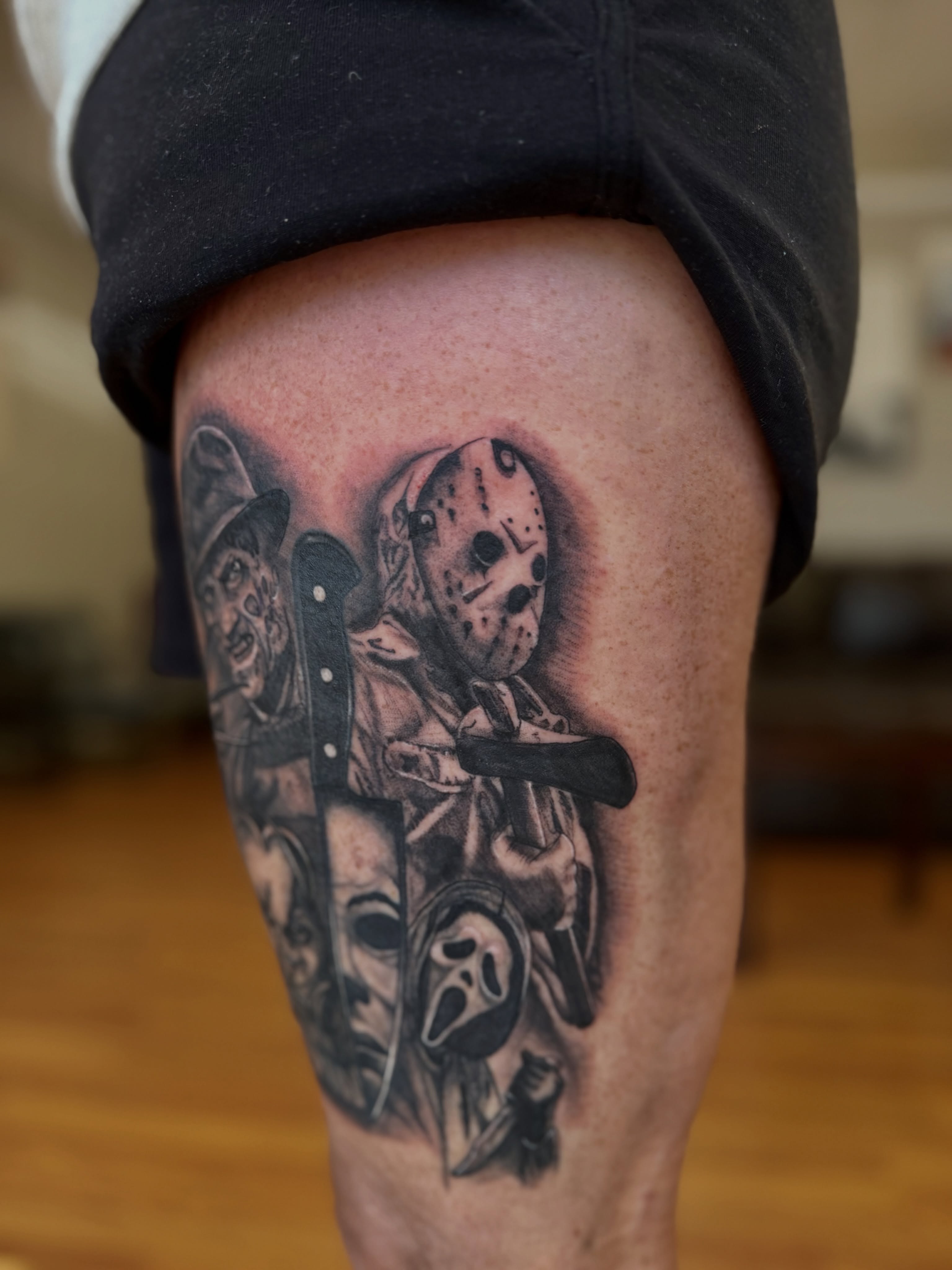 Horror movie characters realism tattoo on the thigh by Skylar Sheeley