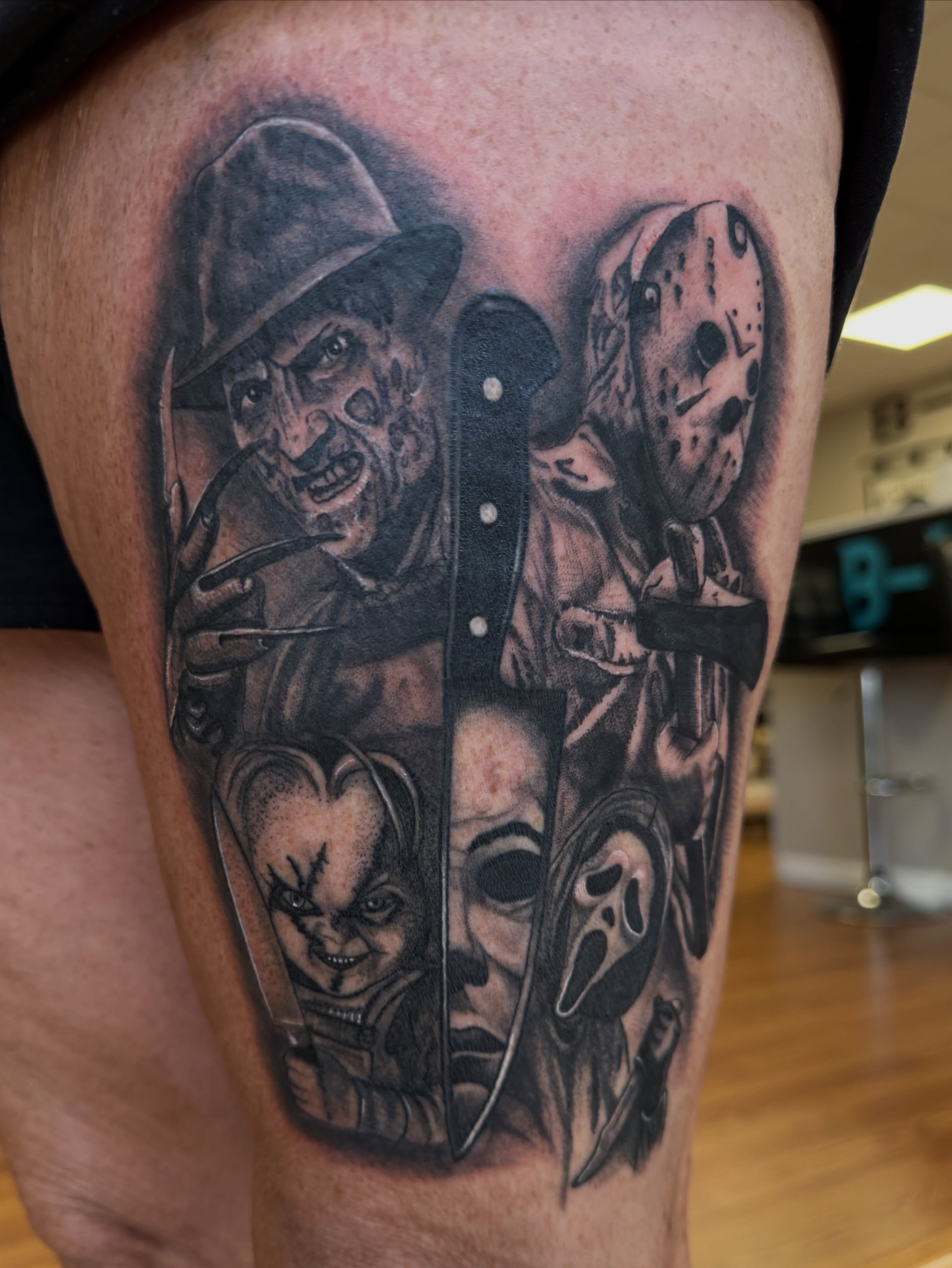 Horror movie characters realism tattoo on the thigh by Skylar Sheeley