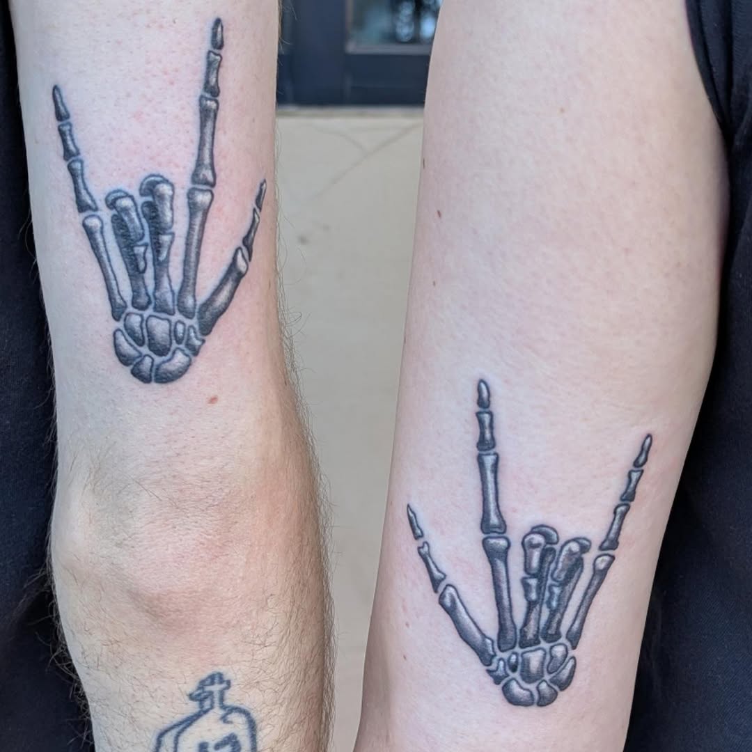 Skeleton hand rock on minimalist tattoo on the forearm by Raven FM-Tattoo Apprentice