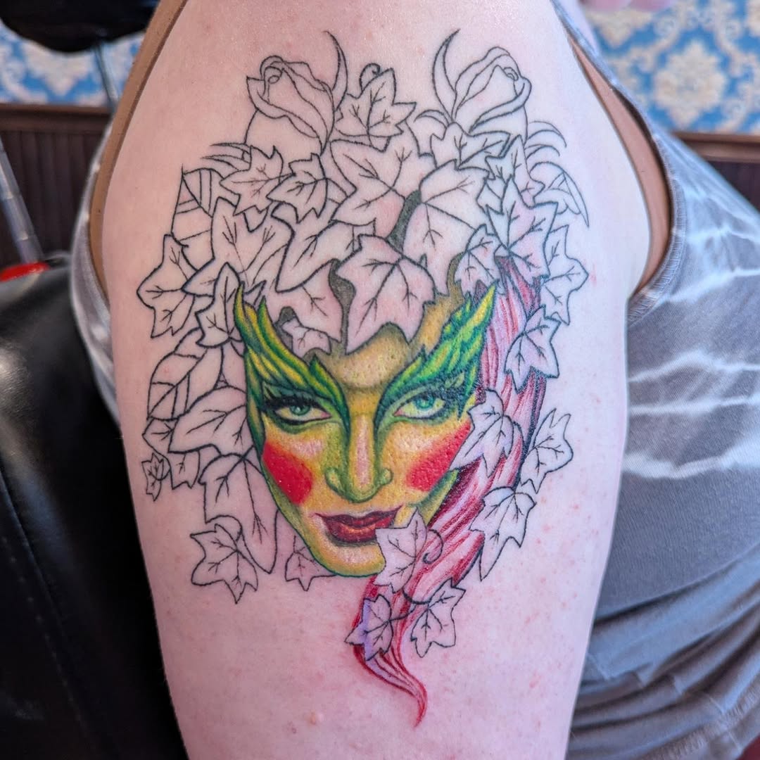Poison Ivy face with leaves neo-traditional tattoo on the thigh by Raven FM-Tattoo Apprentice