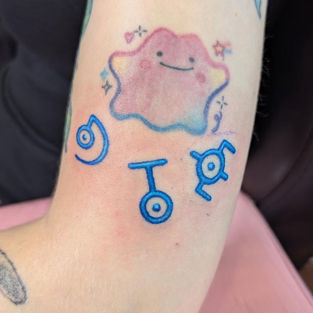 Ditto and Unown symbols new school tattoo on the forearm by Raven FM-Tattoo Apprentice