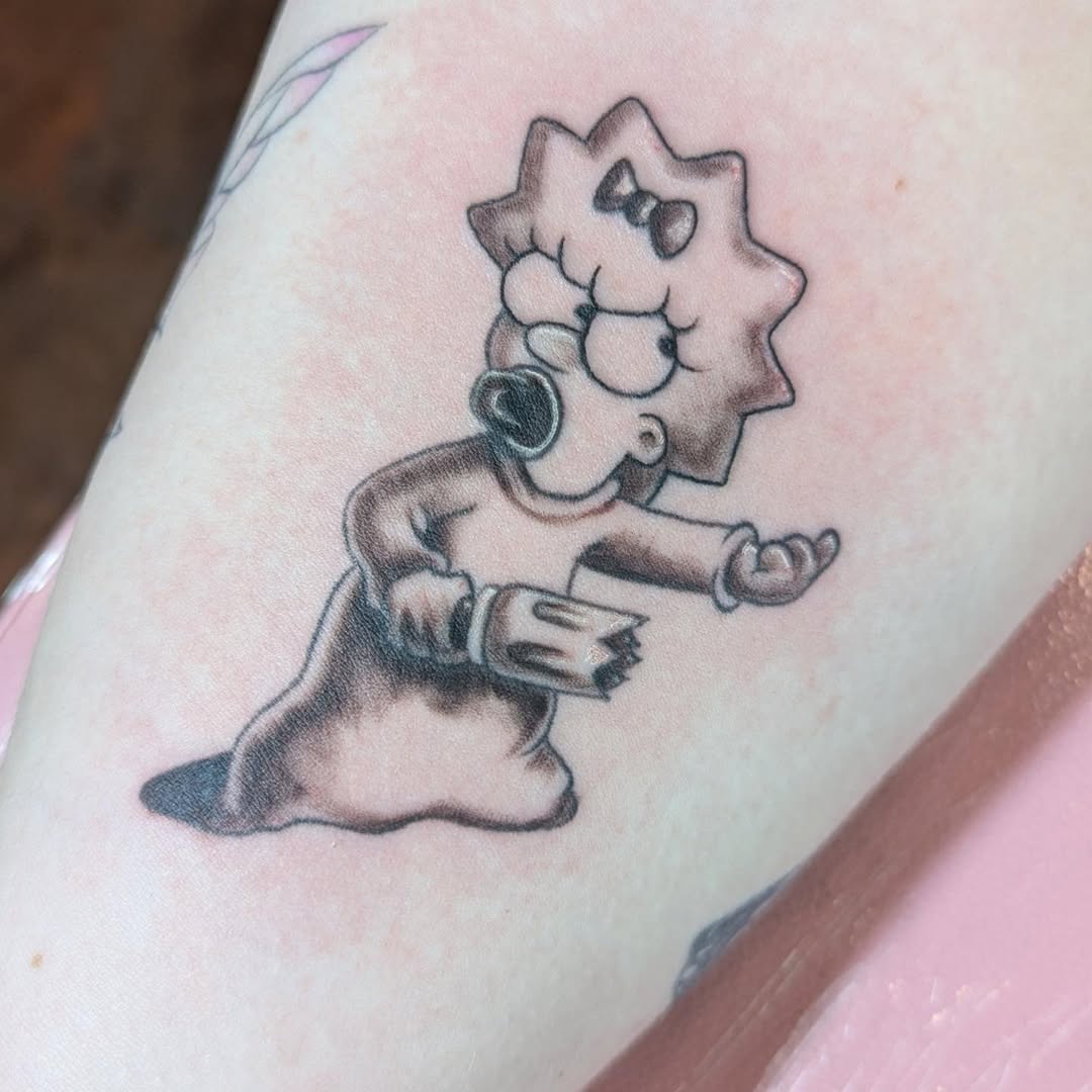 Maggie Simpson with pacifier new school tattoo on the forearm by Raven FM-Tattoo Apprentice
